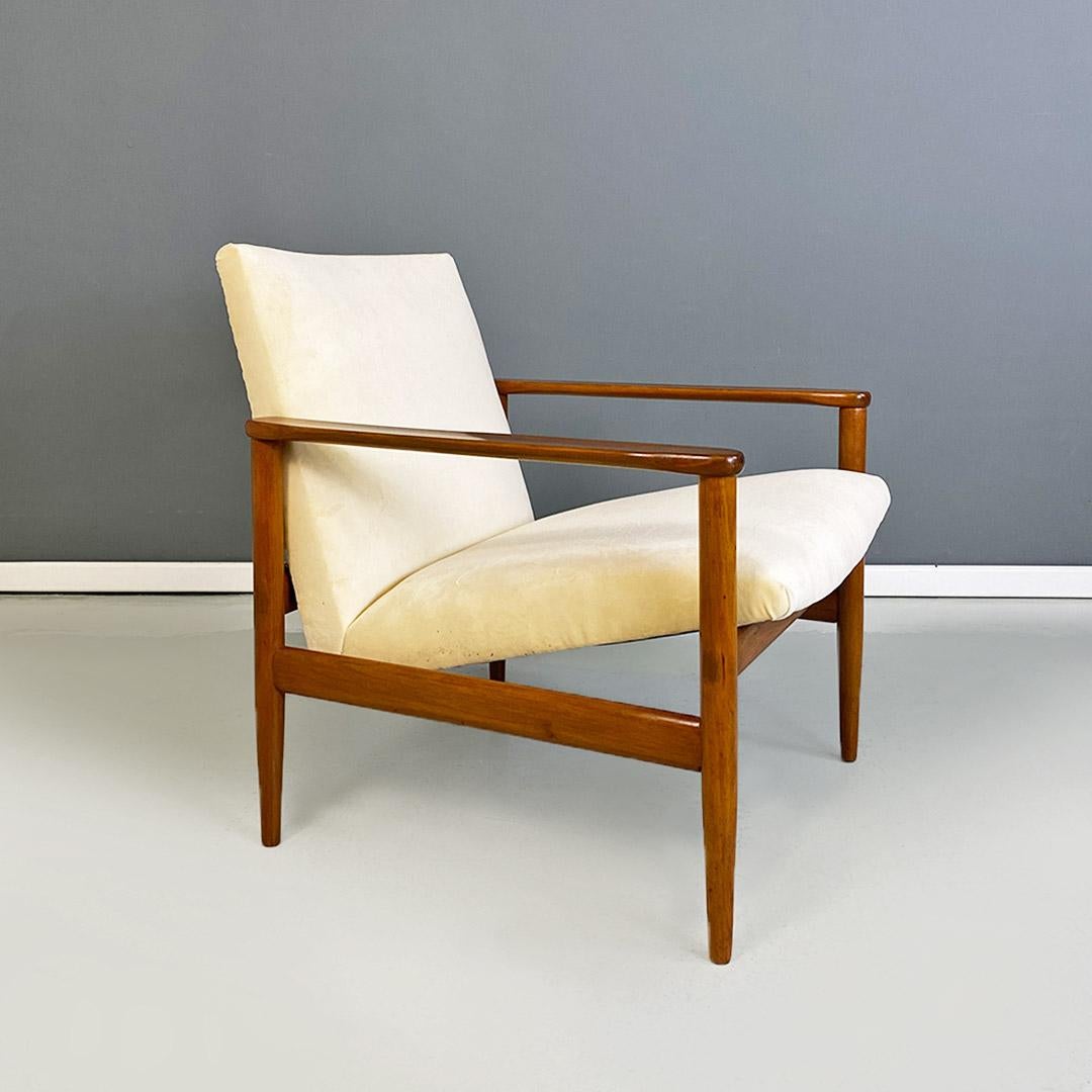 North European Mid-Century Modern cream white velvet and solid beech armchair, 1960s
Armchair originating from northern Europe, with a small-sized structure in solid beech, with shaped armrests and a curved seat hooked to the rear strip by means of