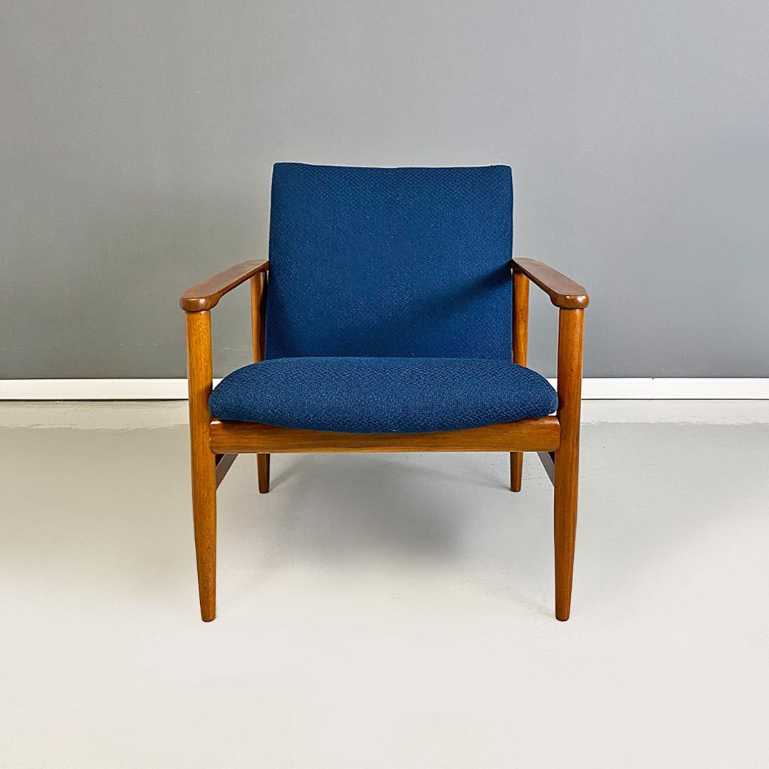 North European Mid-Century Modern solid beech and blue fabric small Size armchair, 1960s.
Armchair from northern Europe with solid beechwood structure, small in Size, with shaped armrests and curved seat hooked to the back strip using two metal