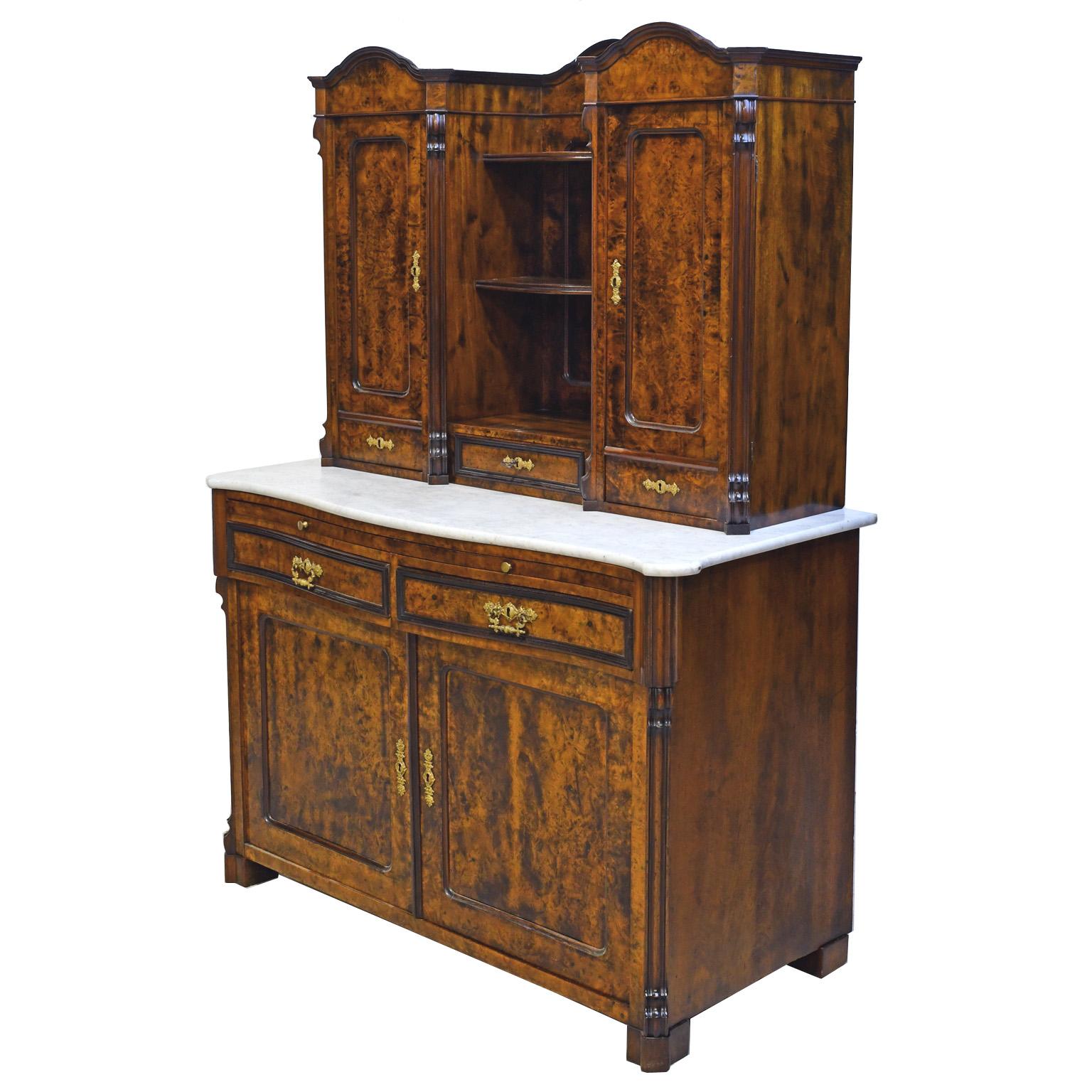 A German Louis-Philippe buffet in fine burled walnut with upper cabinet resting on white Carrara marble top over a base with a pull-out work station. This beautiful cabinet offers multiple drawers of different sizes and closed as well as open
