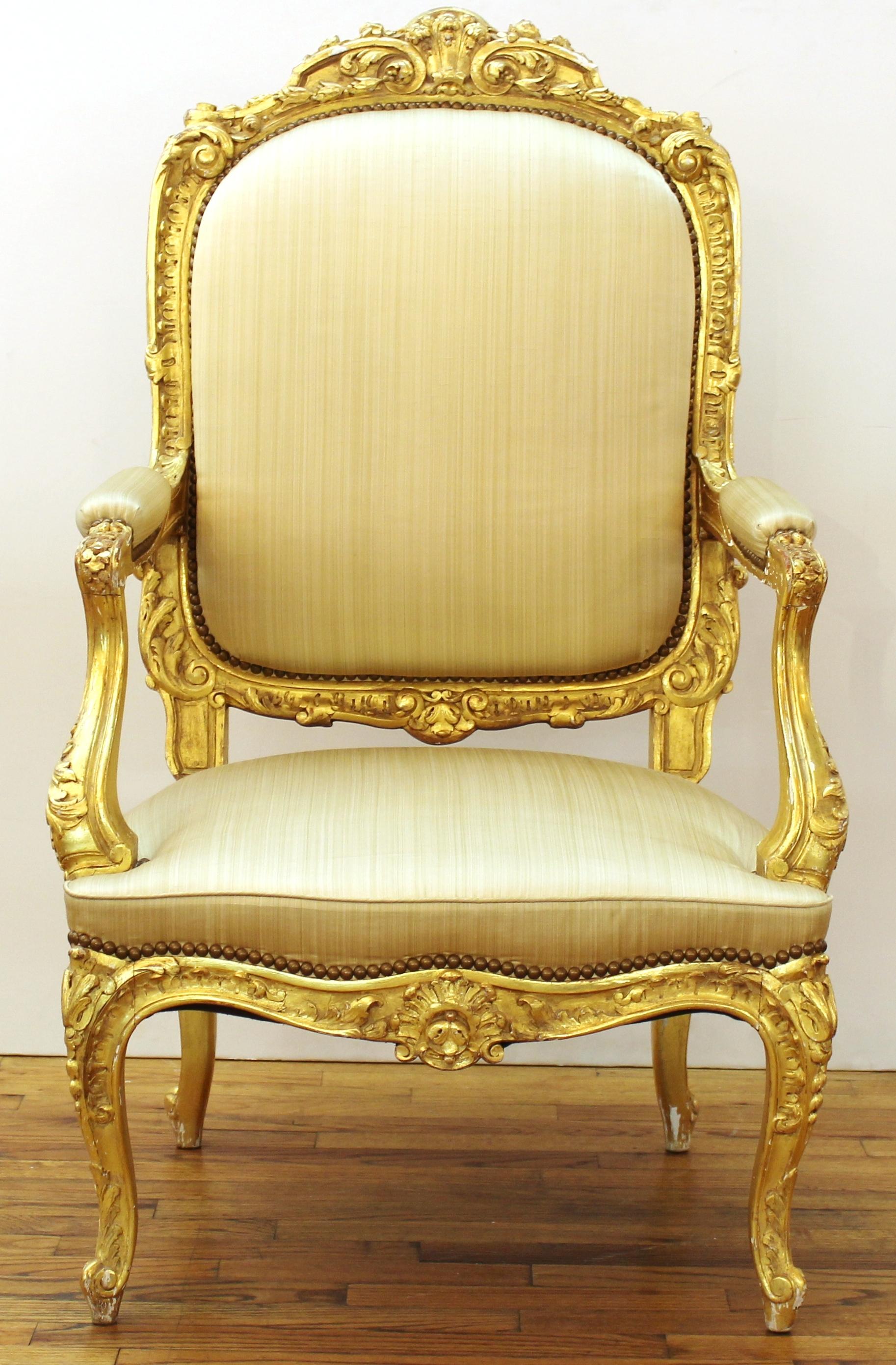 North Italian Baroque set of two giltwood fauteuils a la reine, mid-18th century. Minor chips to giltwood. Some age-related staining and tears to the fabric.