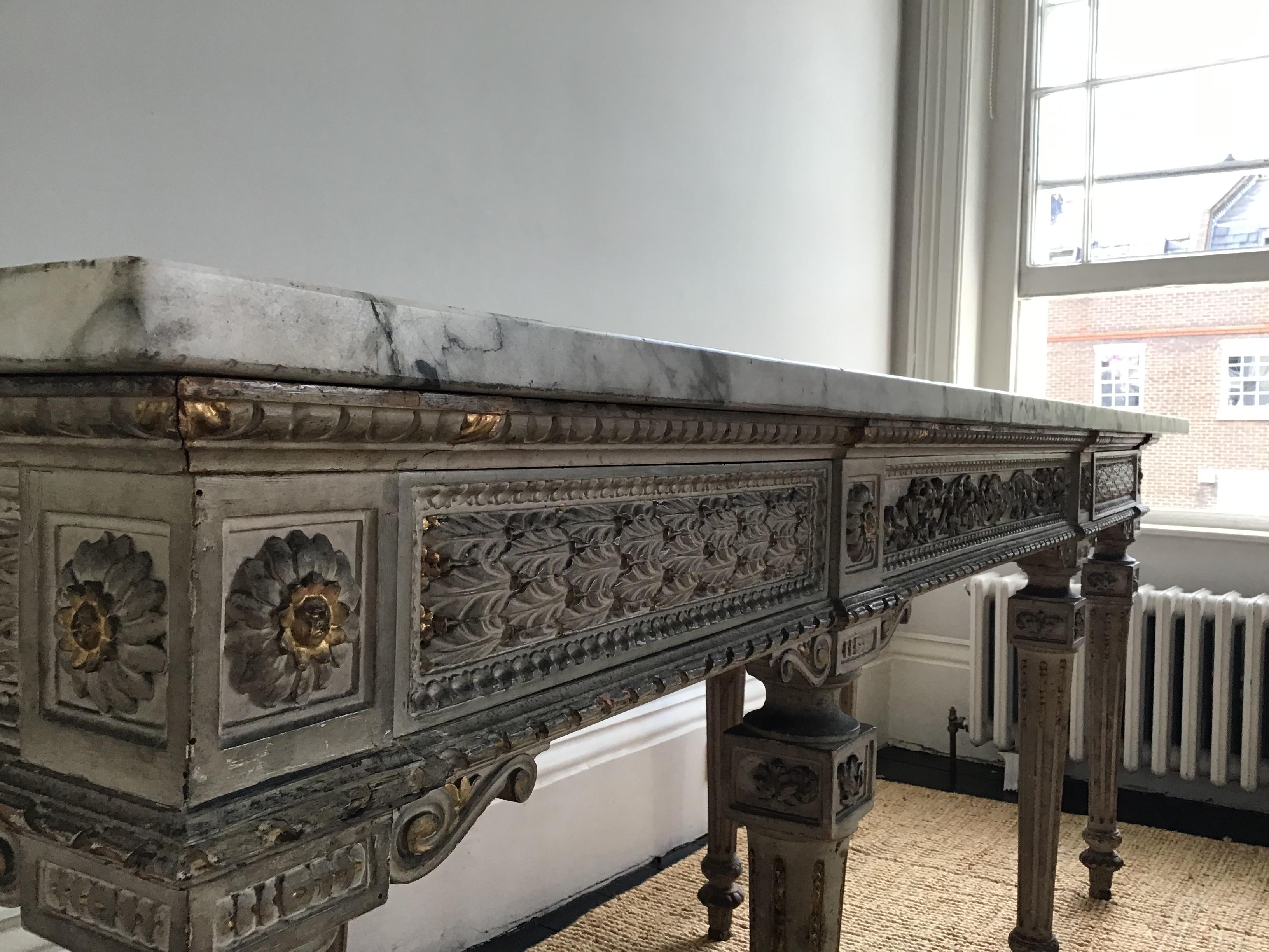 Late 19th century Italian Louis XVI style the rectangular single slab Breche Violette marble above three blind frieze drawers and fluted tapering supports the whole carved and gesso moulded with anthemion motif and scroll detail
Sold by Christies