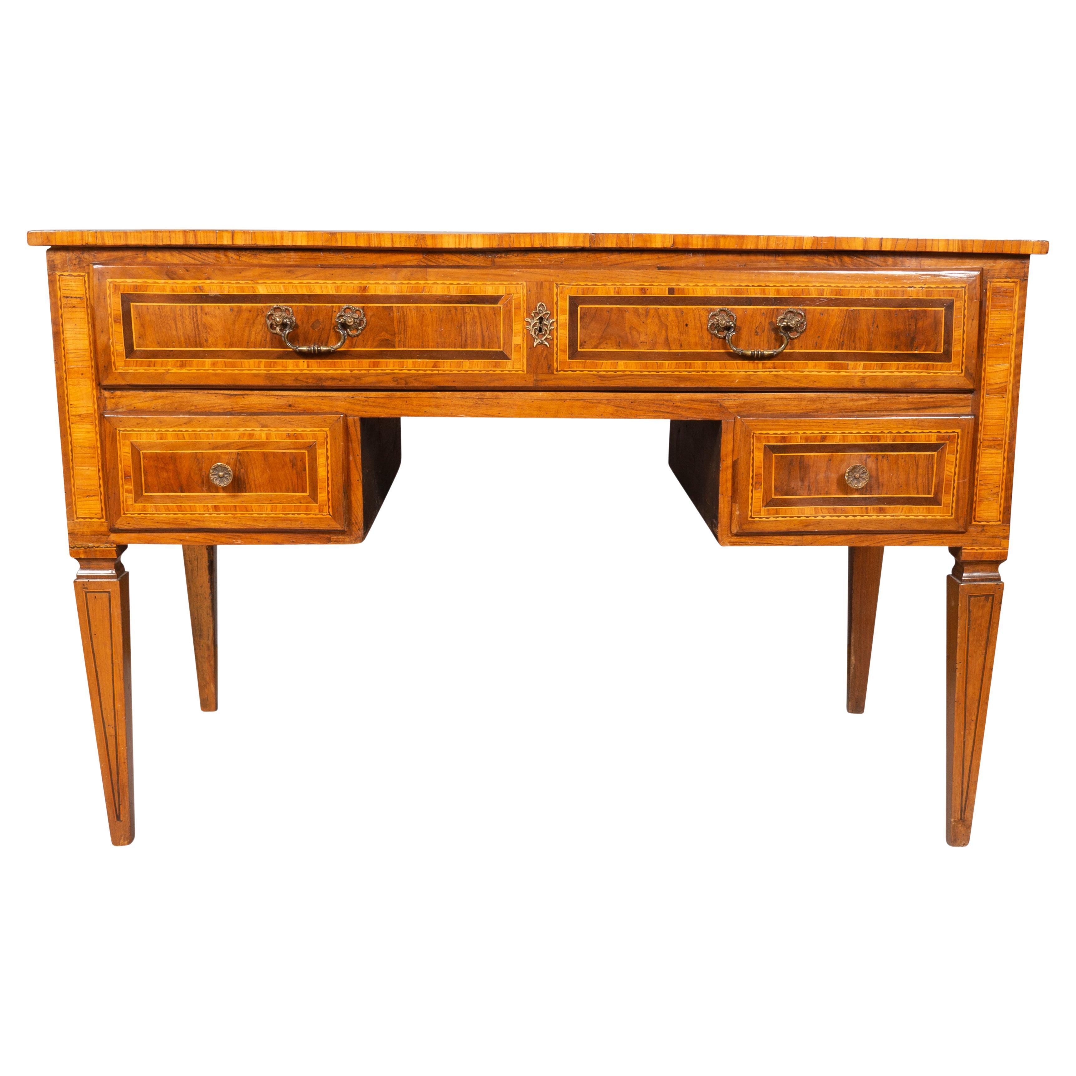 With rectangular top with a geometric pattern inlay over a long drawer over two smaller drawers , back and sides with same fine inlays, raised on square tapered legs. Excellent condition for a period piece.