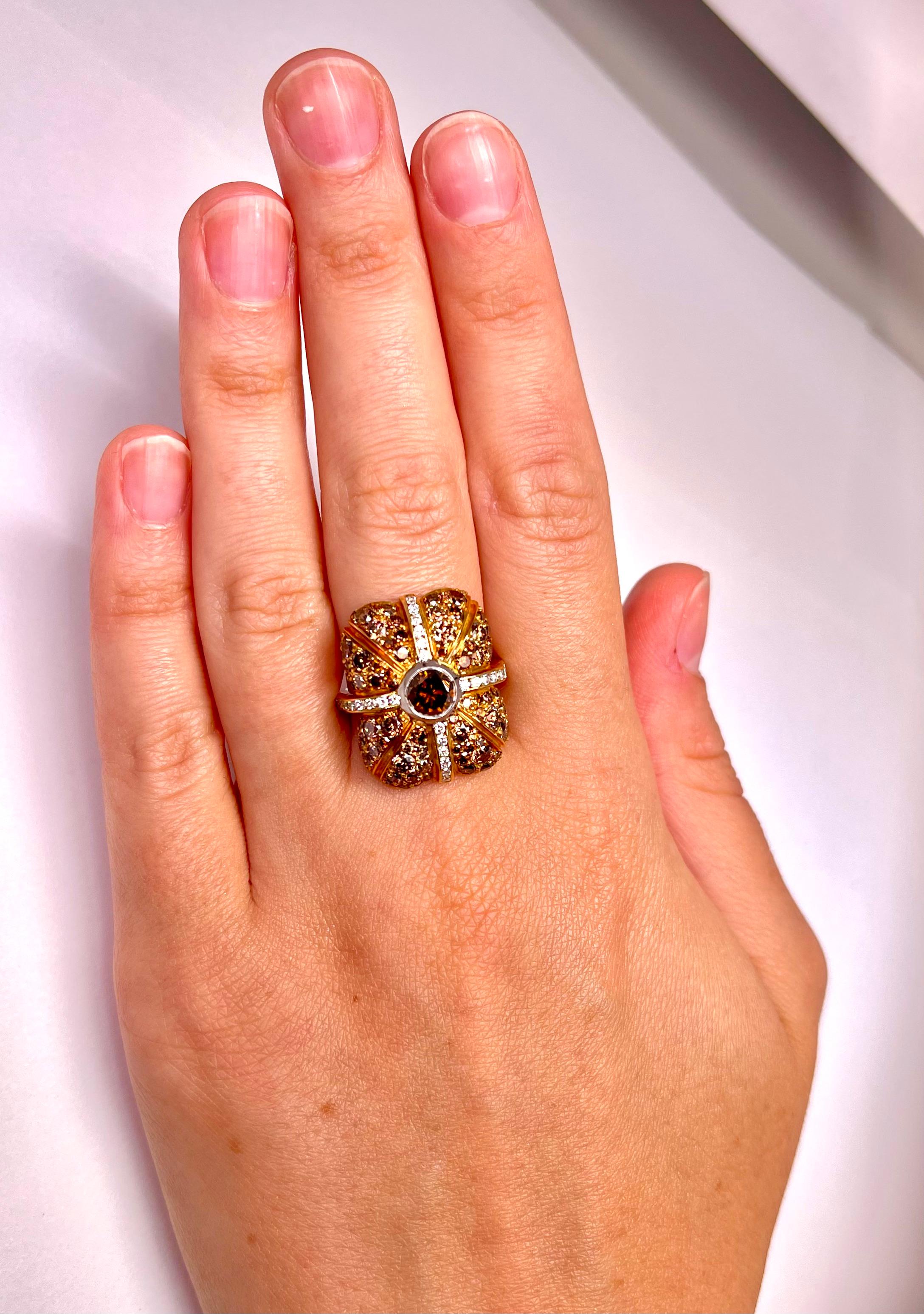 Diamond Ring with cross band of  pave set Diamonds, center stone is .70ct Orange-Brown VS2 Round cut diamond and graduating natural fancy earth tone VVS-SI1 diamonds (Brown, Orange) total of 4.10cts. Set in 18K Yellow gold. Finger size: 6.5.