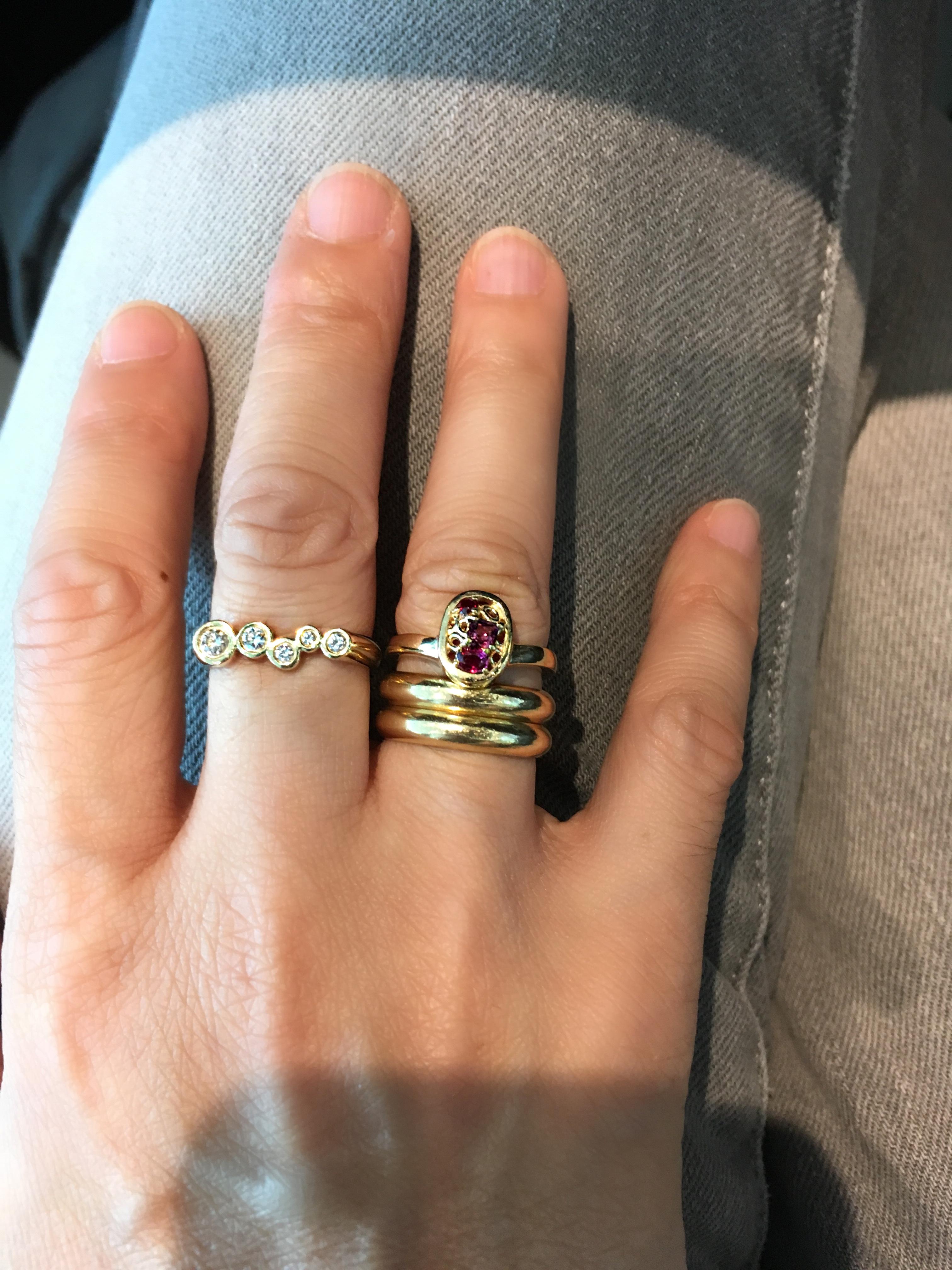 The Slightly curved ring band is made to stack neatly with your favorite rings. 
Cluster of tonal red gem stones set amongst Hi June Parker's signature organic
circles with a tapered ring band for a comfortable fit.

Inspired by seeing the