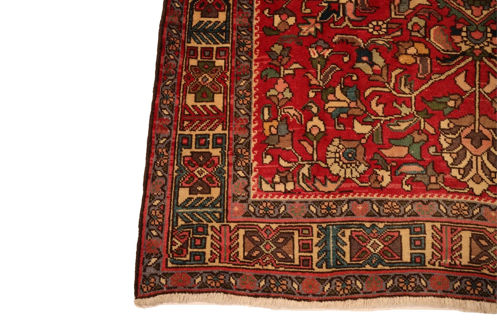 Introducing the Northwestern Persian Runner, a vibrant and captivating masterpiece that seamlessly blends tradition and artistry. This exquisite rug boasts a deep red background that immediately commands attention, creating a bold foundation for the