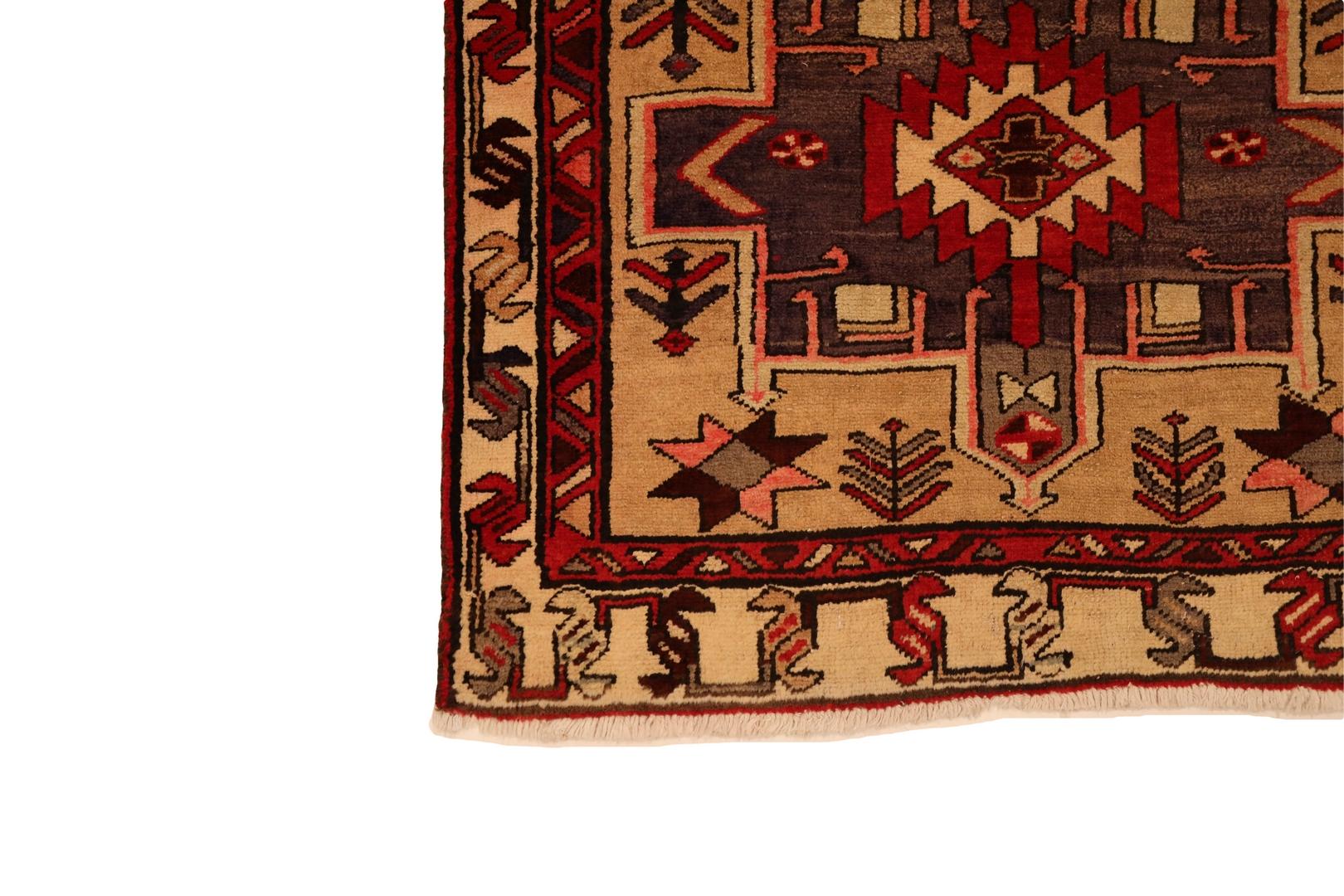 can you write me a rug description for a north west persian runner. The runner has a deep beige background with medallions in purple red and ivory. The medallions share the same geometric 8 sided shape with a jagged wide hexagon medallion in the