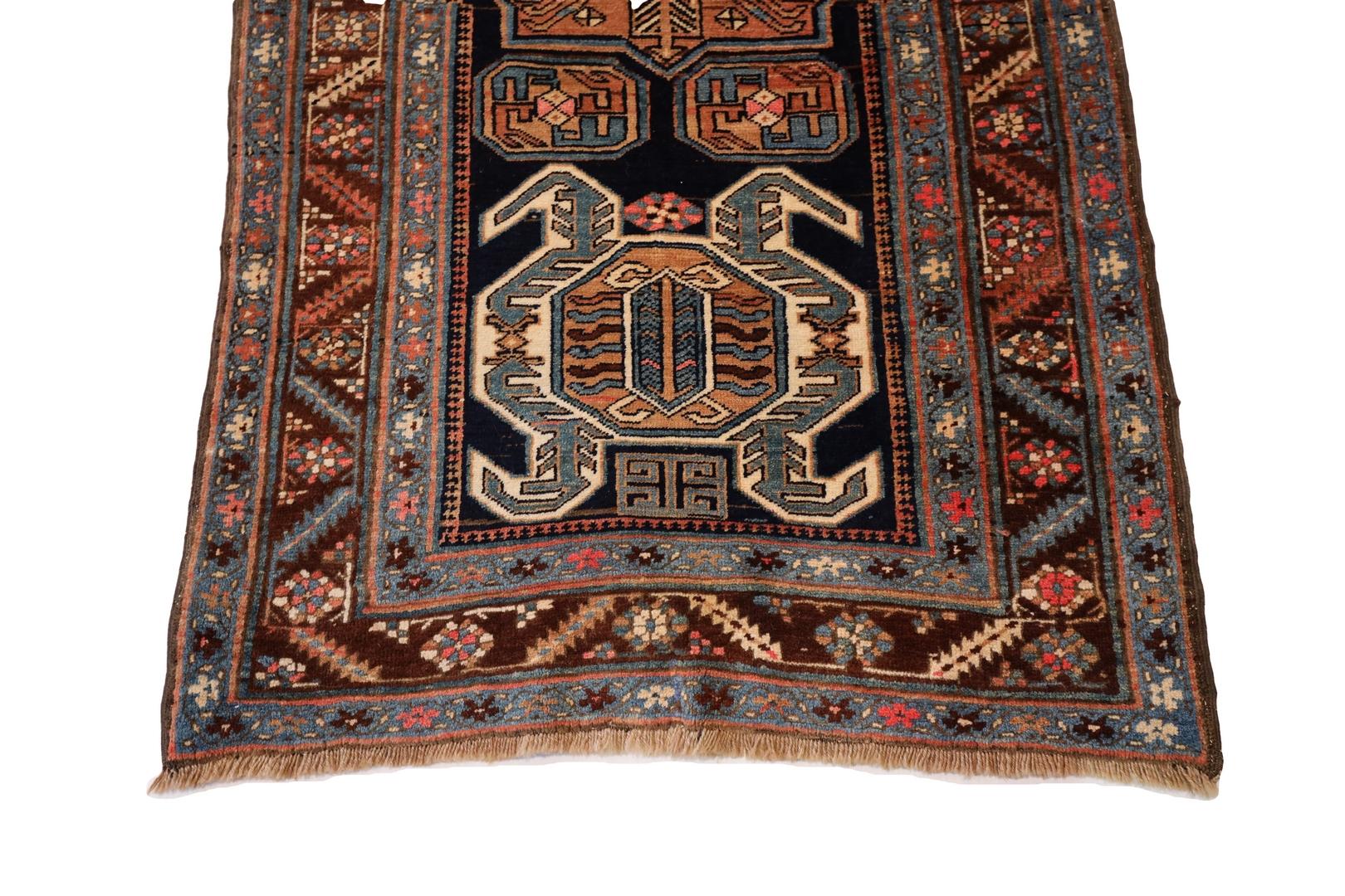 Adorn your living space with the timeless elegance of a Northwest Persian rug that captures the essence of classic design and masterful craftsmanship. This exquisite rug boasts a rich navy background, an opulent canvas that sets the stage for a