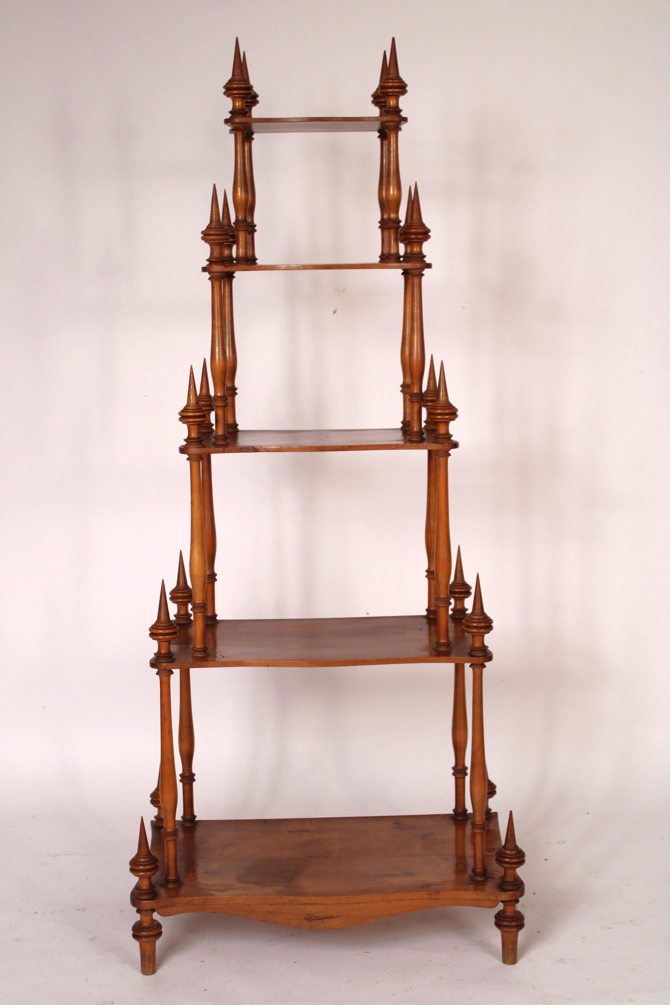 Biedermeier style 5 tier fruit wood etagere, late 19th century. With 5 shelves all 5 shelves are graduated in size with serpentine shaped front edges, each shelf has 4 spire shaped finials. Excellent for displaying a collection of art objects or for