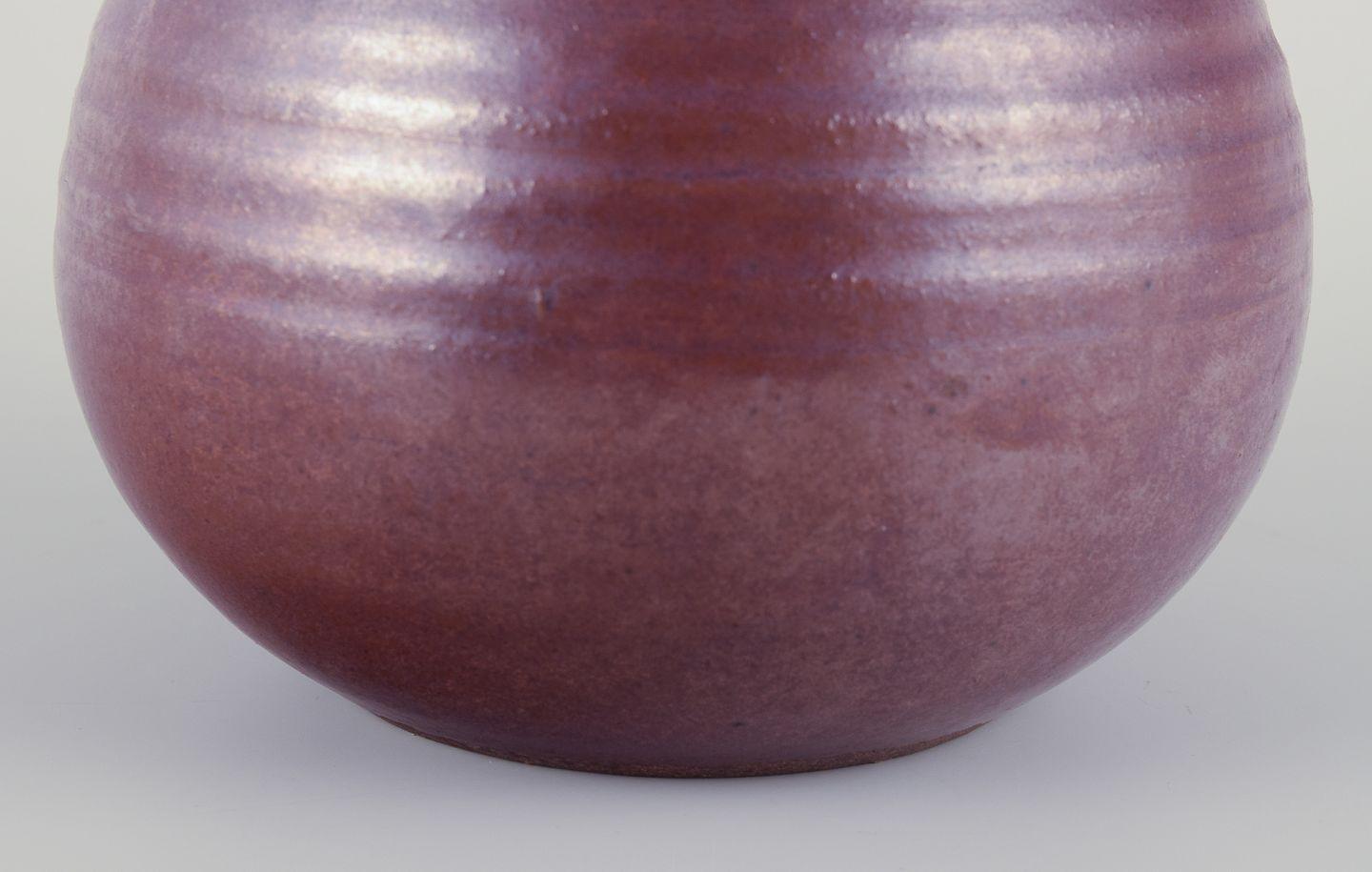 Glazed Northern European studio ceramicist. Ceramic vase with a round shape. Ca 1970s For Sale