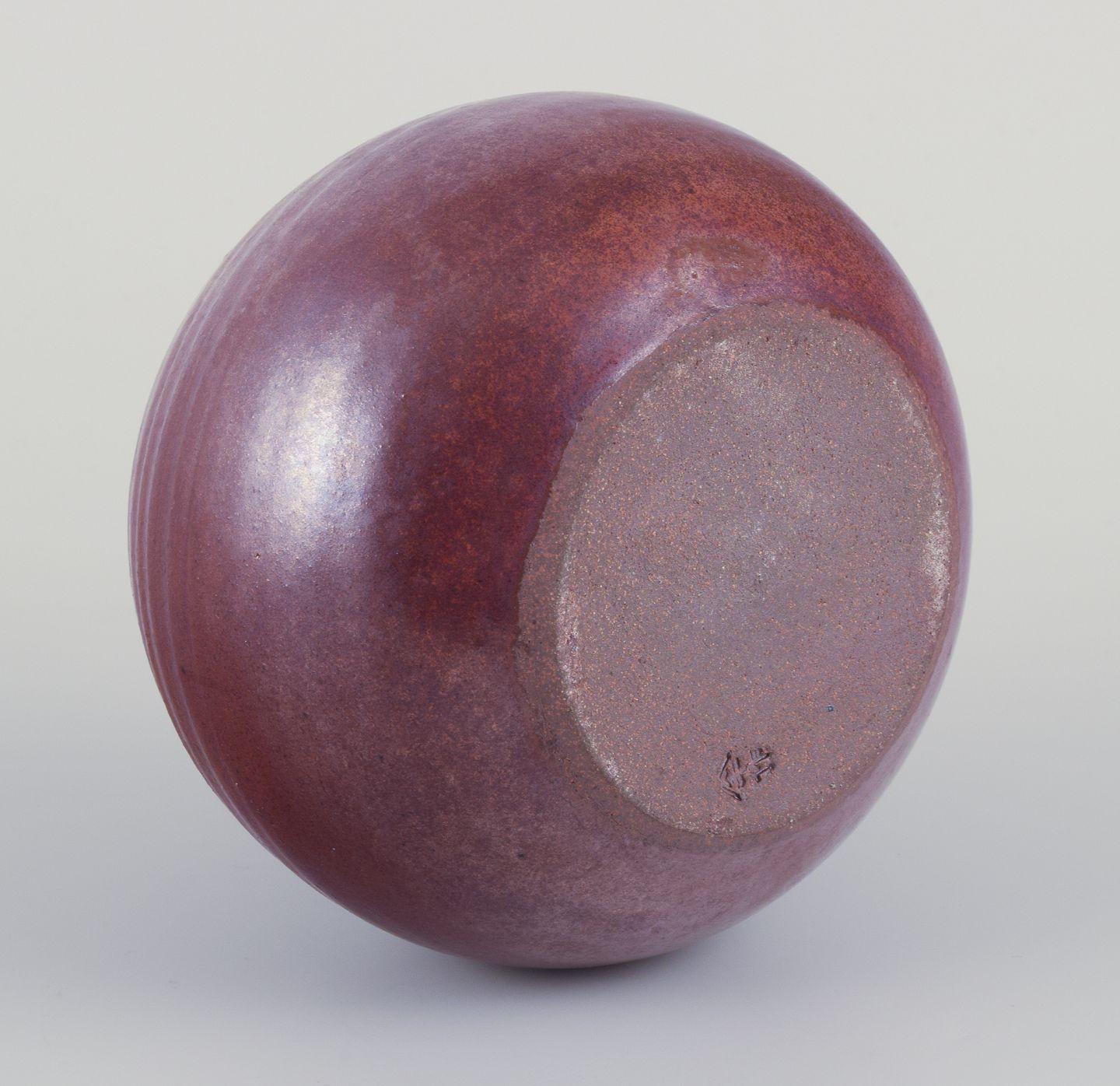 Late 20th Century Northern European studio ceramicist. Ceramic vase with a round shape. Ca 1970s For Sale