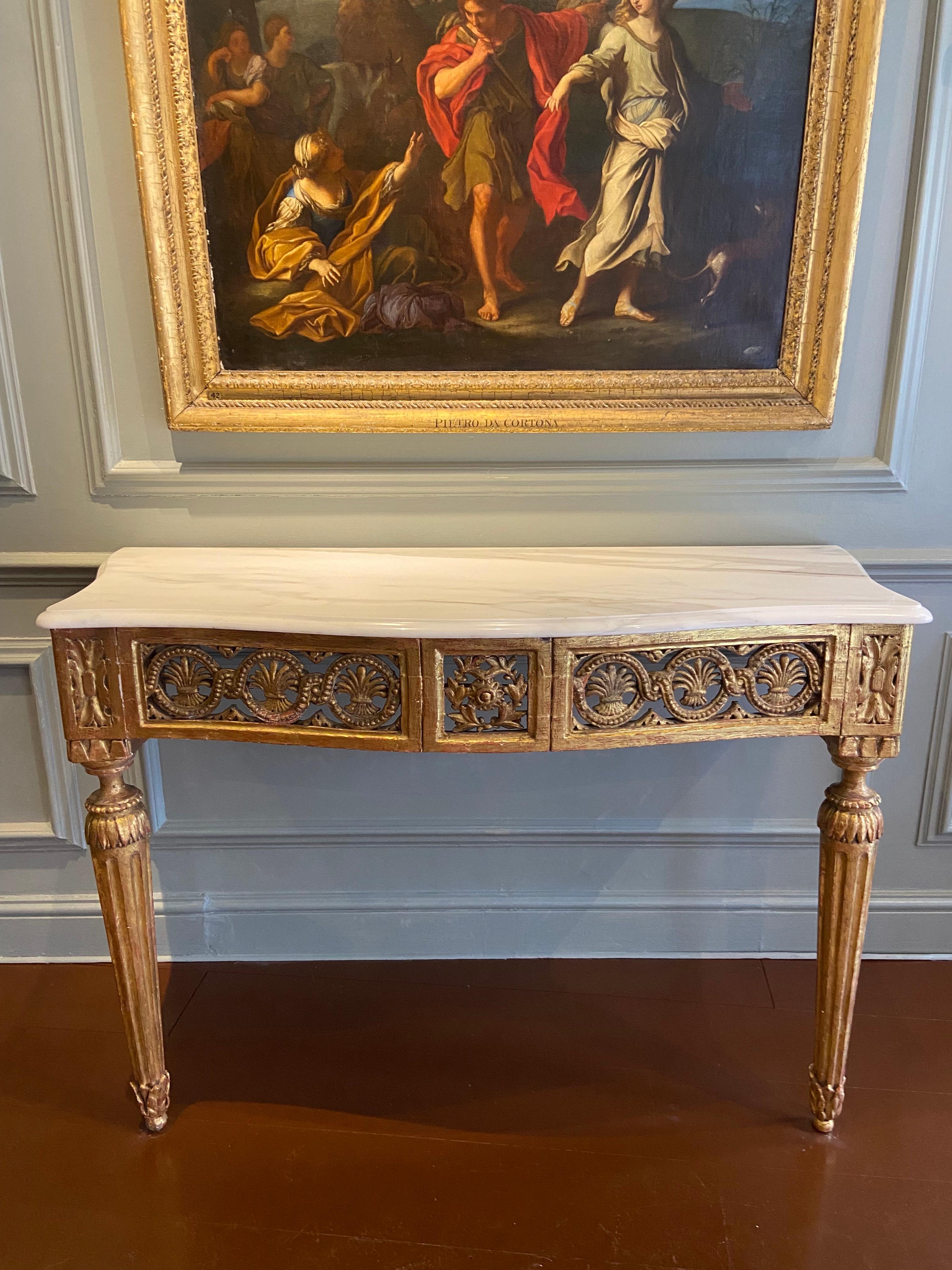 Northern Italian serpentine carved Gilt-Wood console table (Late 18th Century). Pierced wheat sheaf frieze with later white marble top.