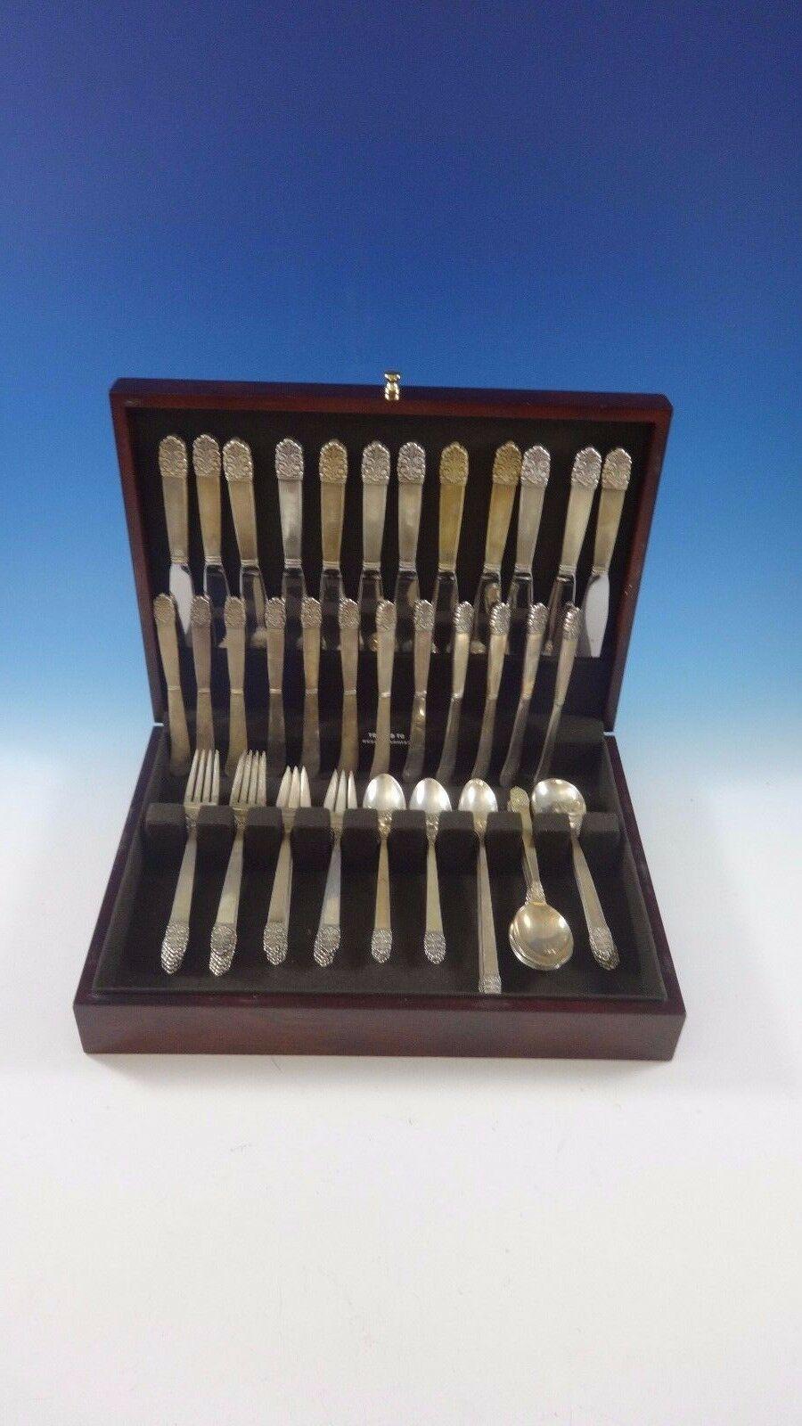 Gorgeous Northern lights by international sterling silver flatware set - 84 Pieces. This set includes:

12 knives, 8 7/8