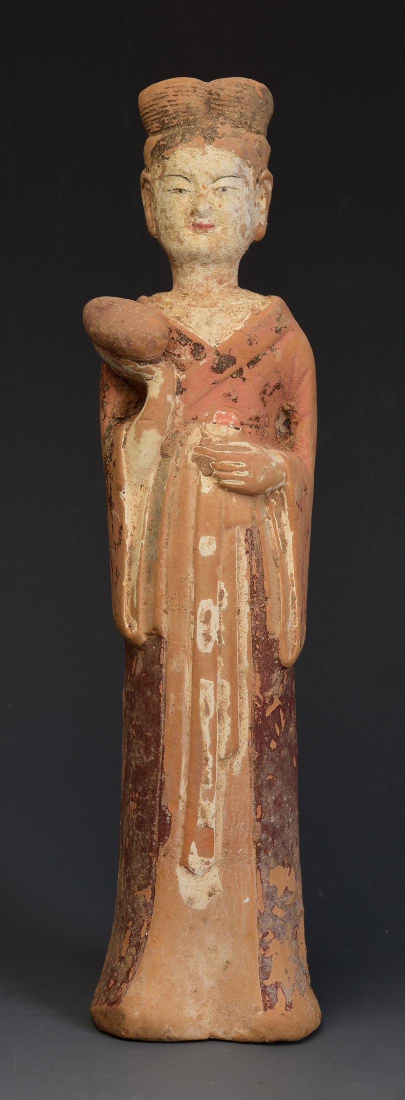 Antique Chinese painted pottery standing court lady, with original pigments remaining.

Age: China, Northern Wei Dynasty, A.D. 386 - 535
Size: Height 20.4 C.M. / Width 5 C.M. / Depth 4.8 C.M.
Condition: Well-preserved old burial condition overall