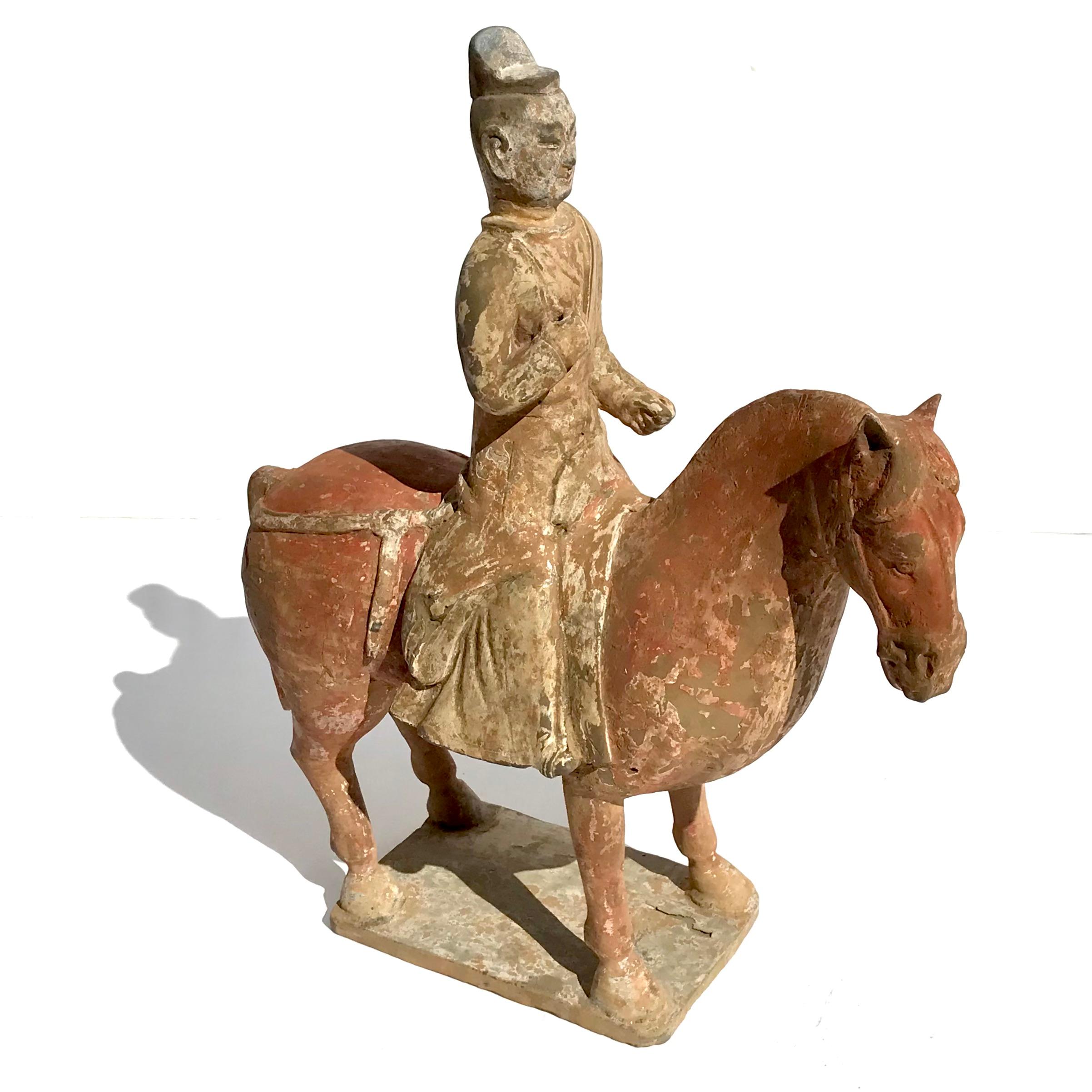Chinese Tomb Painted Pottery Horse with Soldier 
Northern Wei to Tang Dynasty (386-534) 
Height 12.75 Inches x 11 Wide x 3.75 Deep
Provenance: Weisbrod Chinese Art, Ltd., New York
Condition: Very good original condition with wear commensurate of age