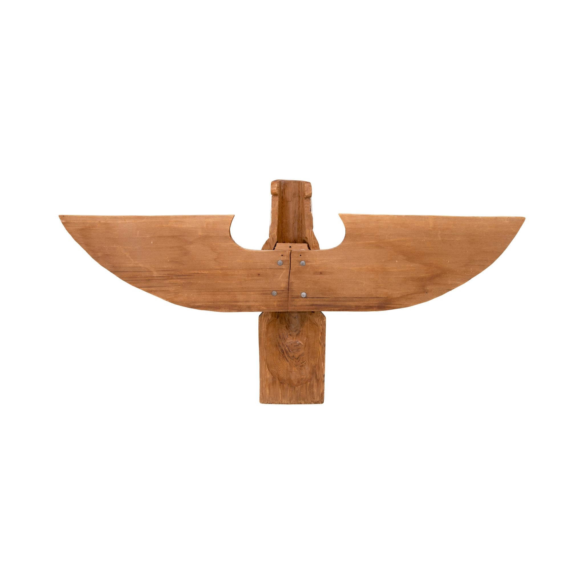 Northwest Coast polychrome thunderbird figure. The carved cedar bird figure with two mounted outstretched wings. Carver Frank Smith, unisgned. 25.25