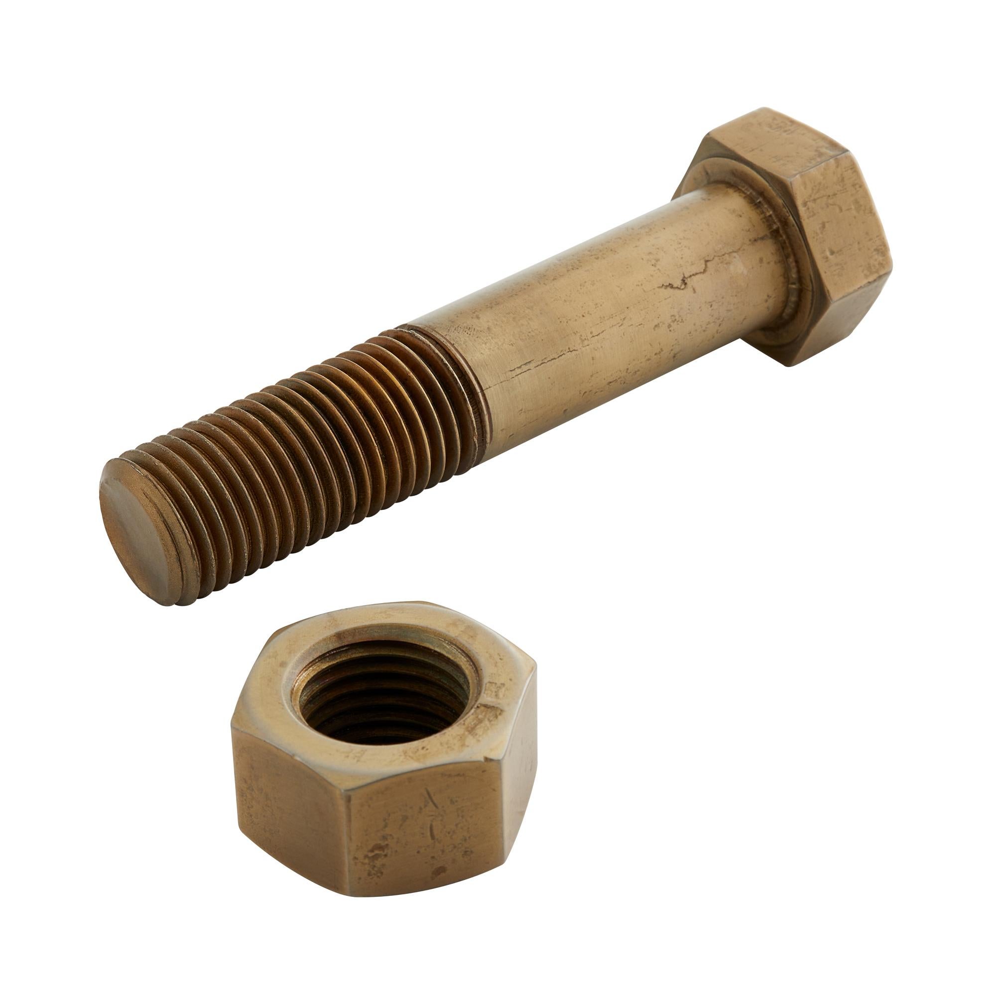 Bring an industrial edge to your décor with this distinctive sculptural accent, inspired by the bold, oversized hardware used in bridge construction. Artful and interactive, the design features a large-scale nut and bolt crafted from iron with an