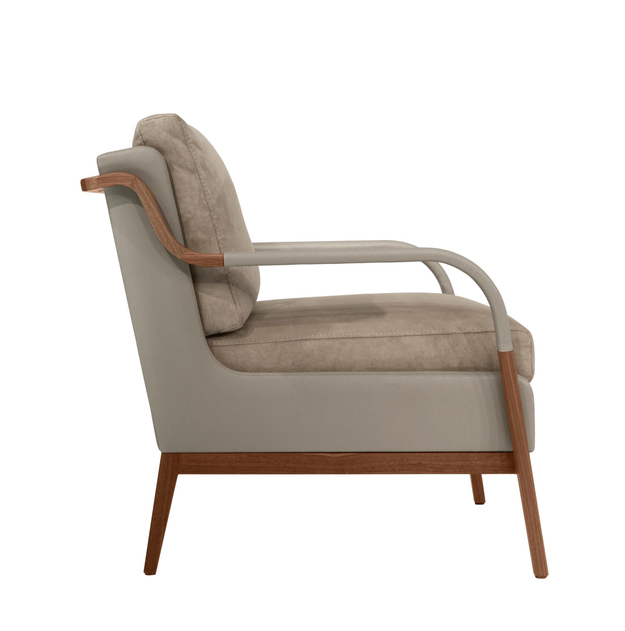 A unique node to Scandinavian design, the Norway armchair beautifully blends fabric, leather, and wood into one sleek silhouette. The elegant curve of the arm and lush seat are a comfortable, eye catching touch for any living space.