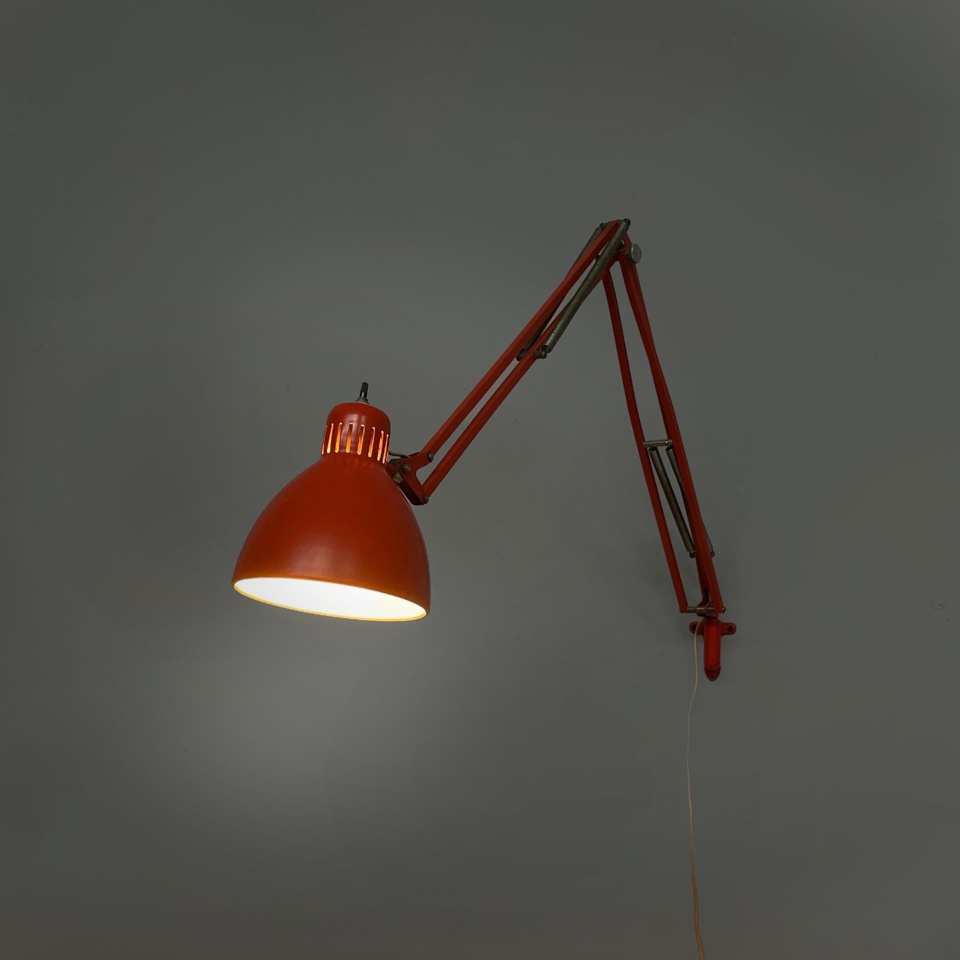 Norway mid-century modern orange adjustable wall lamp Naska Loris by Jac Jacobsen for Luxo, 1950s
Wall lamp model Naska Loris in metal. The adjustable conical shade is made of red-orange metal on the outside and white on the inside. A black switch