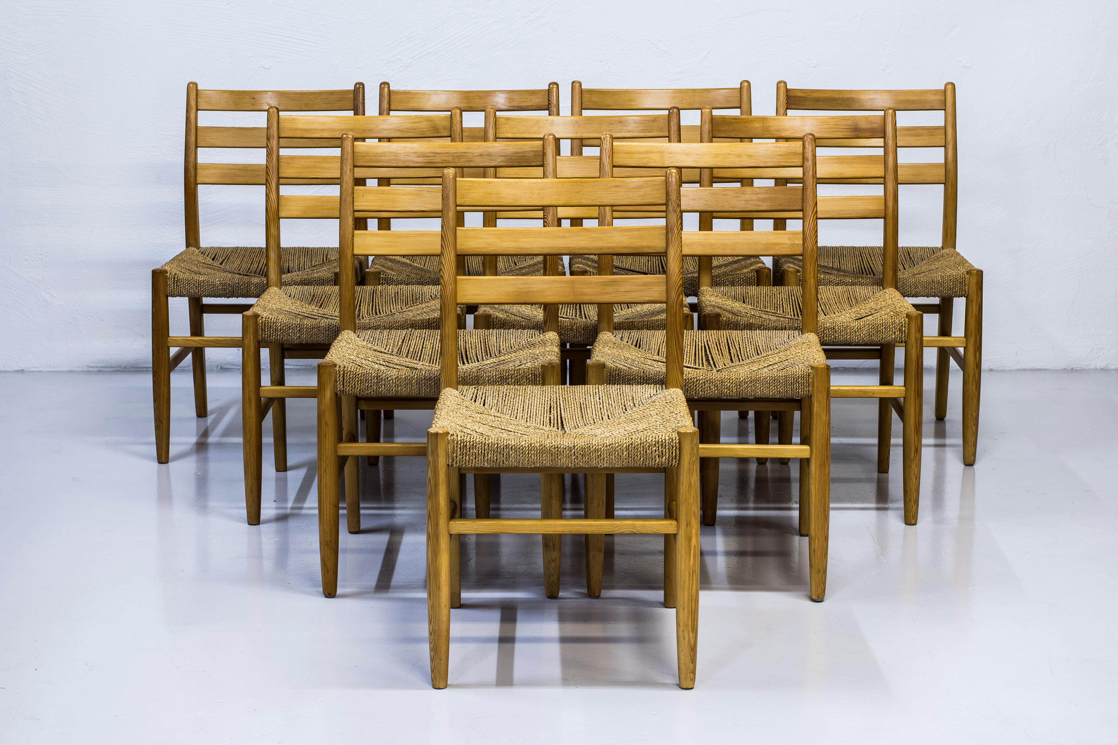 Set of ten dining chairs designed by Harry Moen for Konrad Steinstads Snekkerverksted. Produced in Norway during the 1960s. Made from solid pine with seats of weaved seaweed chord. Very good vintage condition with signs of wear and light
