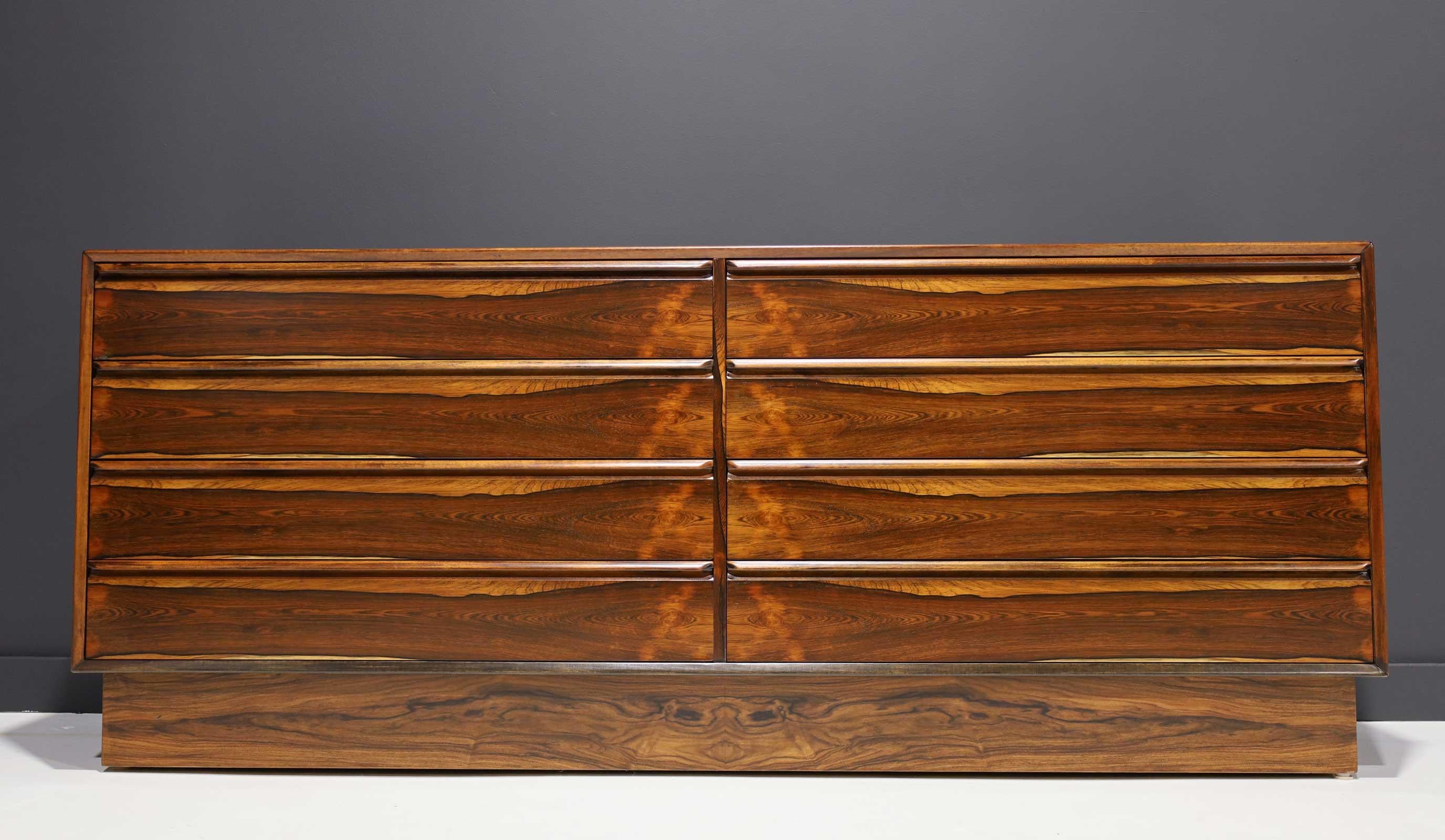 A Norwegian 1960s rosewood eight-drawer chest by Westnofa of Norway. Dresser has a well-figured top above eight side-by-side drawers all in a rich match-booked Brazilian rosewood veneer with solid rosewood moulded handles, A good quality piece with