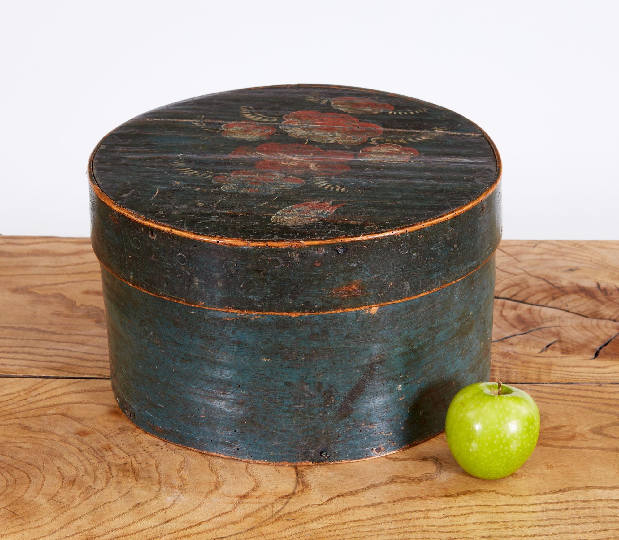 Good early 19th-century Scandinavian paint decorated the bentwood pantry box with stitched seams, retaining original floral decoration and dark robin egg blue paint, with wonderful patinated surface.