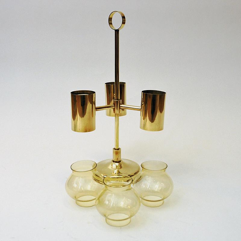 Scandinavian Modern Norwegian Brass Candleholder with three arms and amber colored shades 1960s For Sale