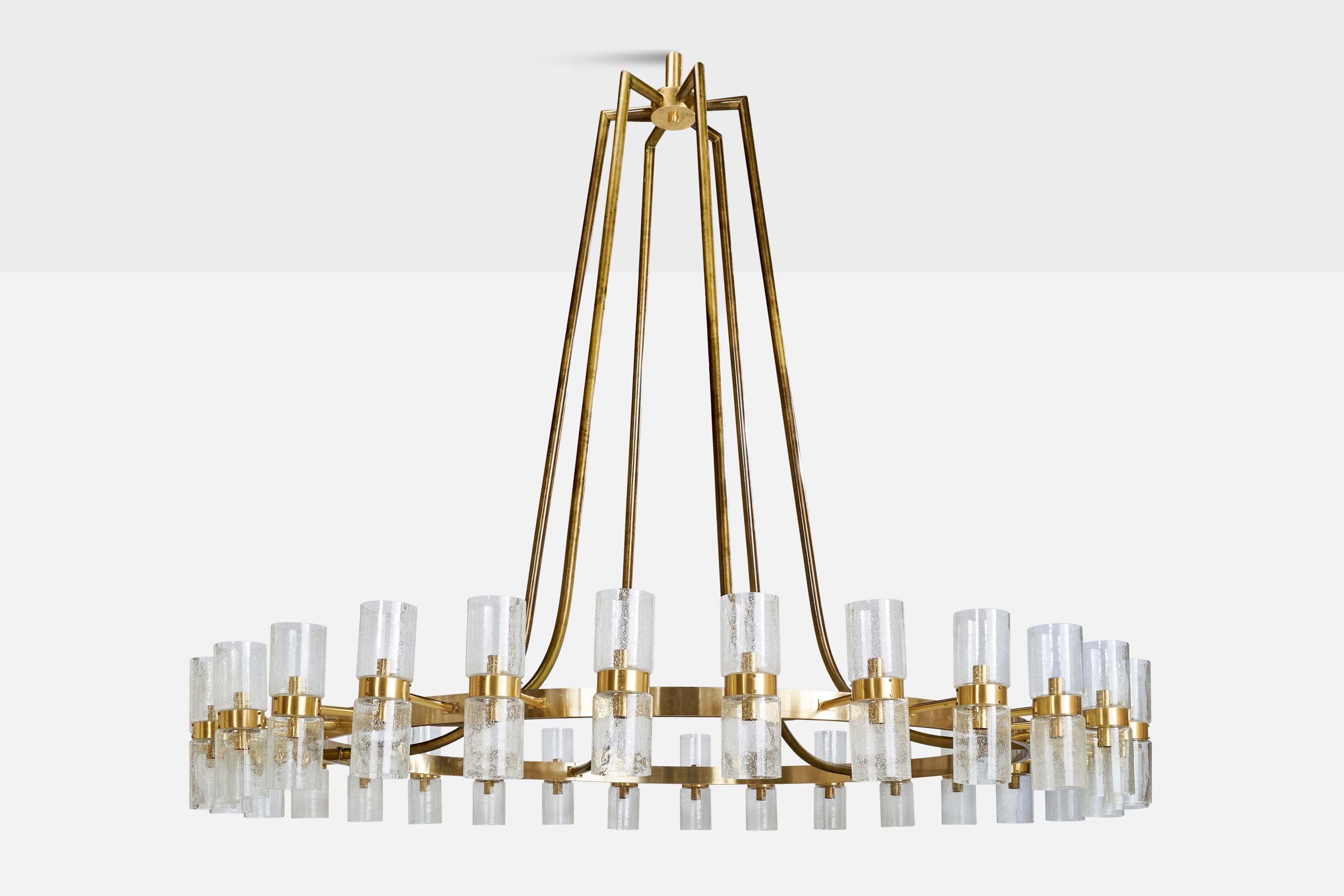A monumental brass and glass chandelier designed and produced in Norway, c. 1965.

Ships disassembled, please inquire for custom shipping quote.

Dimensions of canopy (inches): N/A
Socket takes standard E-26 bulbs. 60 sockets.
There is no maximum