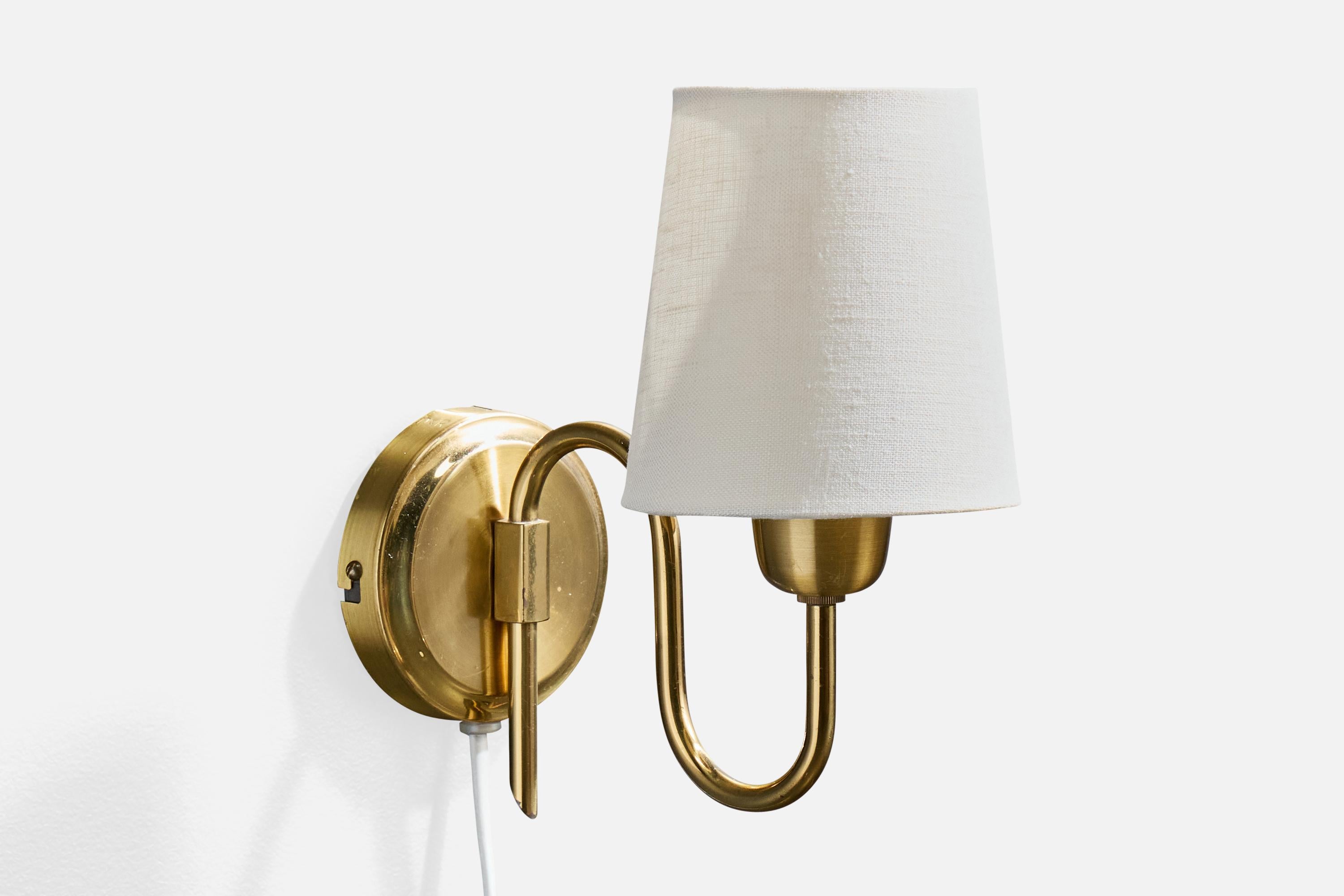 A brass and white fabric wall light designed and produced in Norway, c. 1950s.

Stamped 