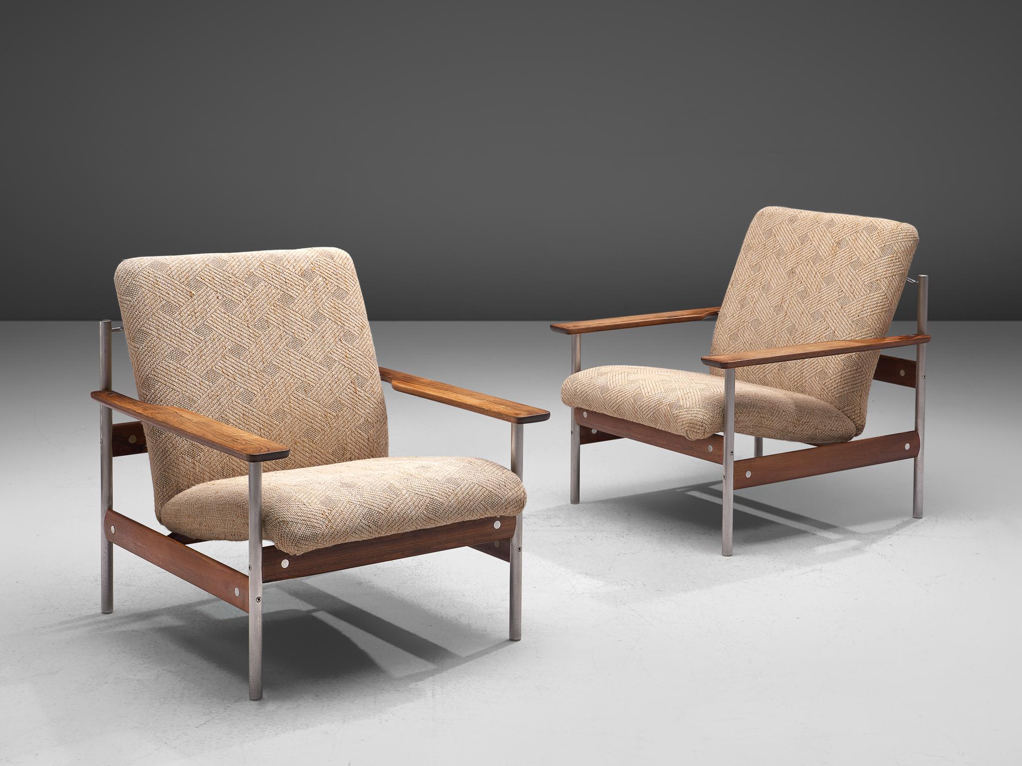 Sven Ivar Dysthe for Dokke Møbler, fabric, rosewood and steel, Norway, 1959.

This set of lounge chairs is designed by Sven Ivar Dysthe for Dokke Møbler. The frame of these armchairs is executed in rosewood and the legs are made out of stainless