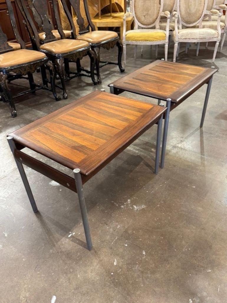 Set of 3 Norwegian MCM rosewood and steel side tables. Circa 1960. If you're drawn to the sleek elegance of Norwegian Mid-Century Modern rosewood and steel side tables, you're tapping into a rarefied corner of Scandinavian design where rich wood
