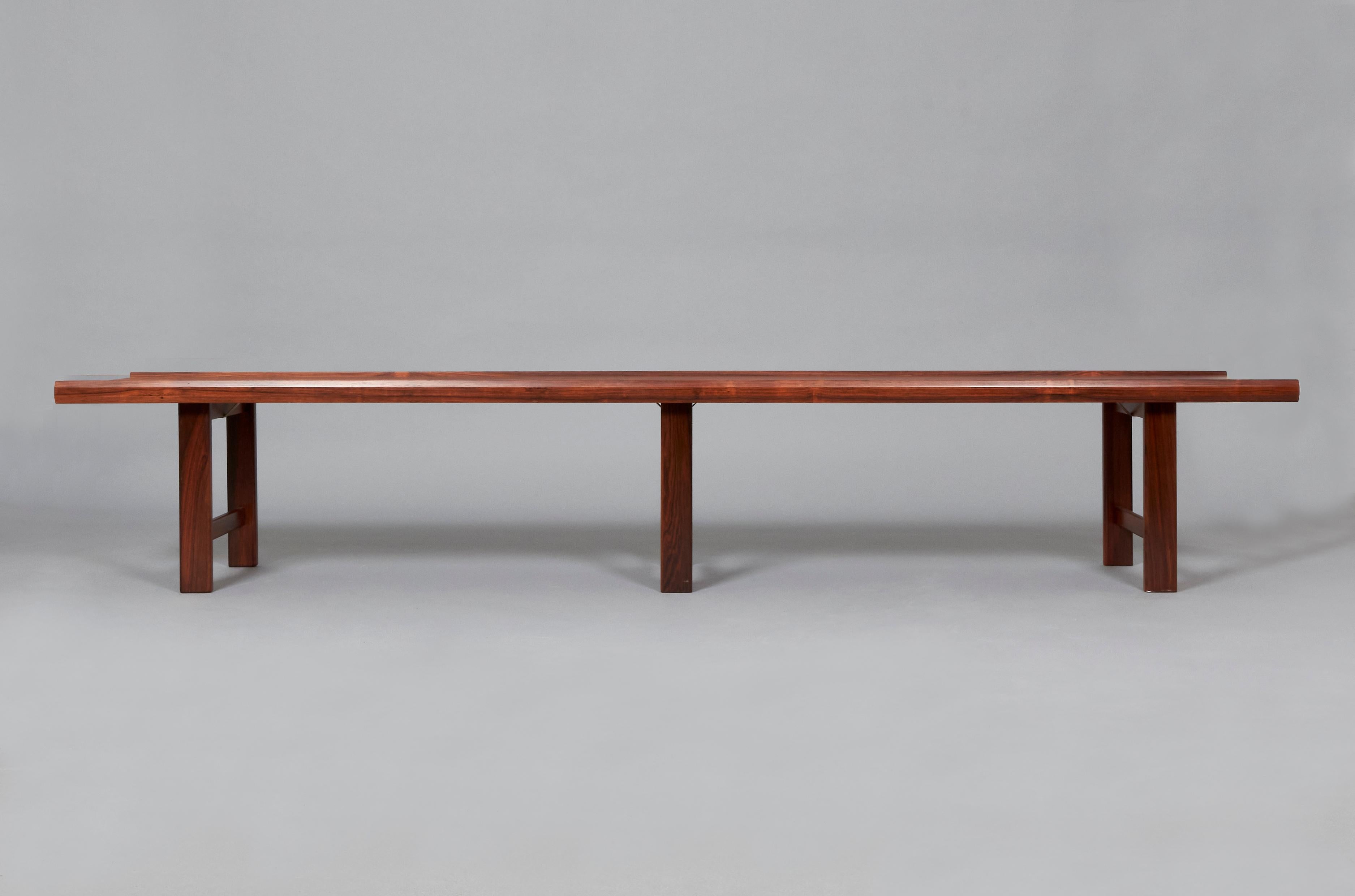 Rosewood bench by an anonymous designer manufactured in rosewood veneer. Norway, 1960s.
This design of clear and simple lines and proportions is a great example of modernist Norwegian design. Its vintage condition is excellent, with original patina