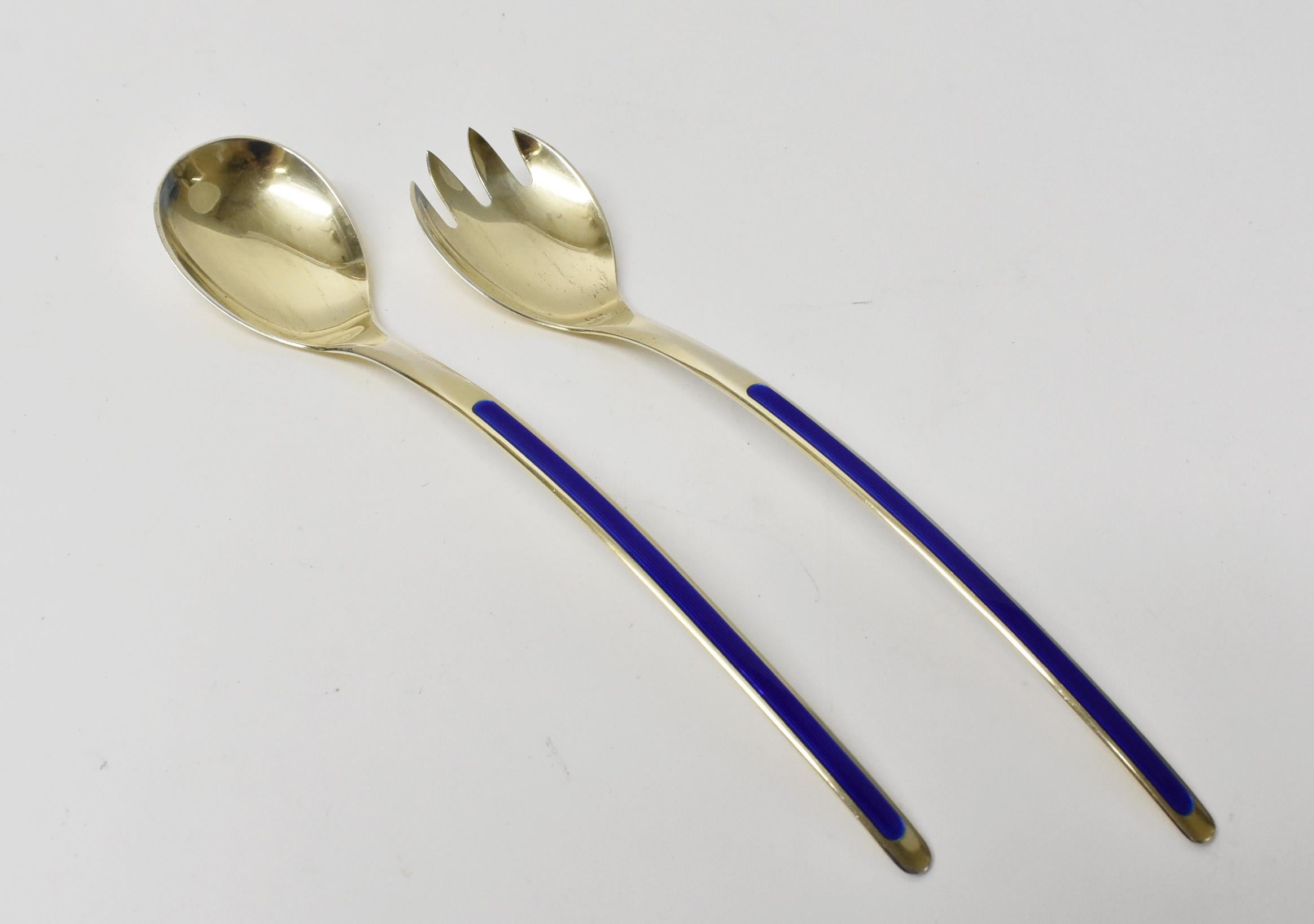 Stylized midcentury sterling and blue enamel serving/salad set with a gold wash by Norwegian designer Thune. Very good condition with wear consistent with age and use. Dimensions: .75