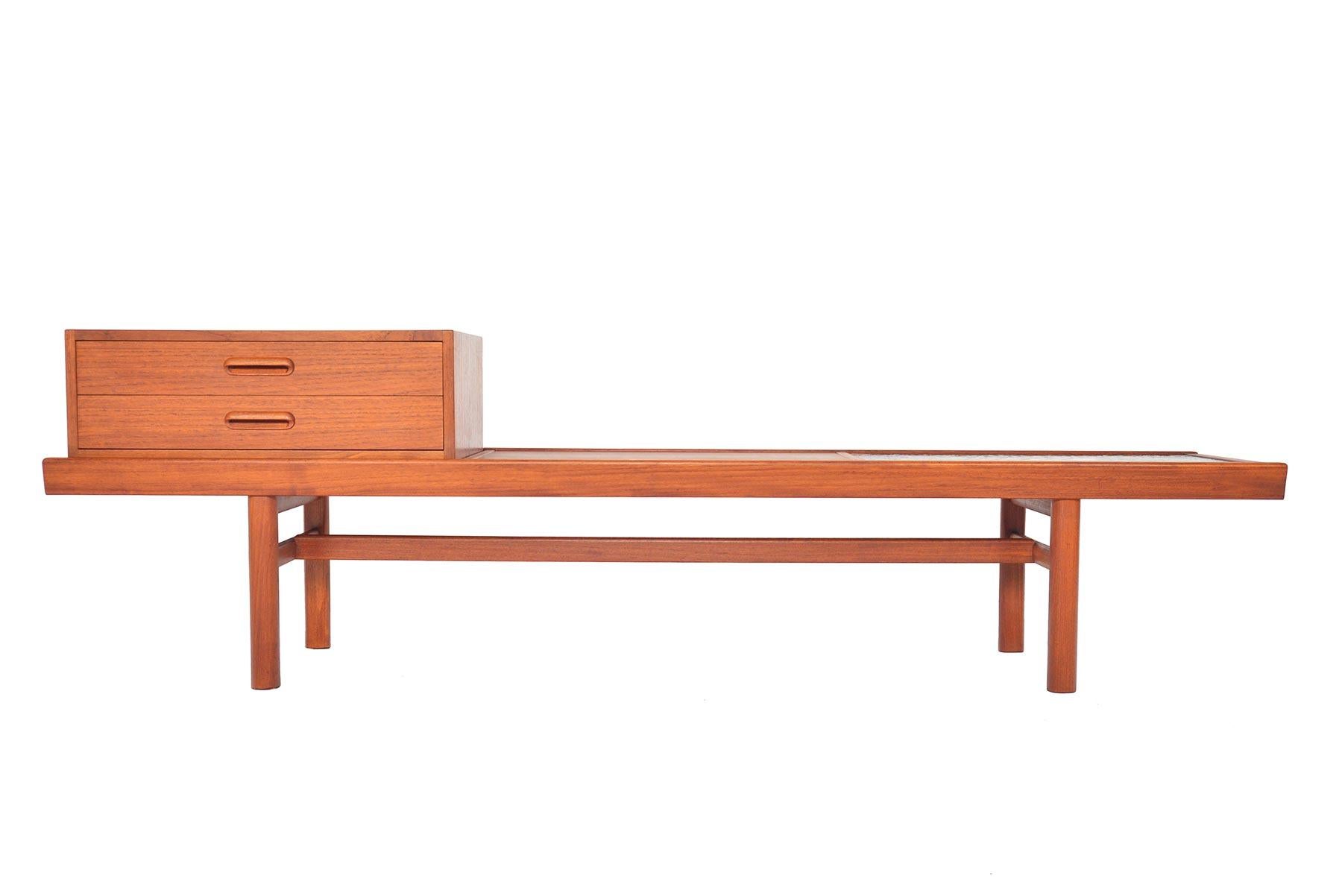 Wonderfully dynamic, this modular teak bench was manufactured by Sola Møbelfabrikken as Model Multiflex Nr. 160. A large teak frame holds three units- a case with two drawers, a teak seat bench, and a resin and stone plate. Pieces can be moved