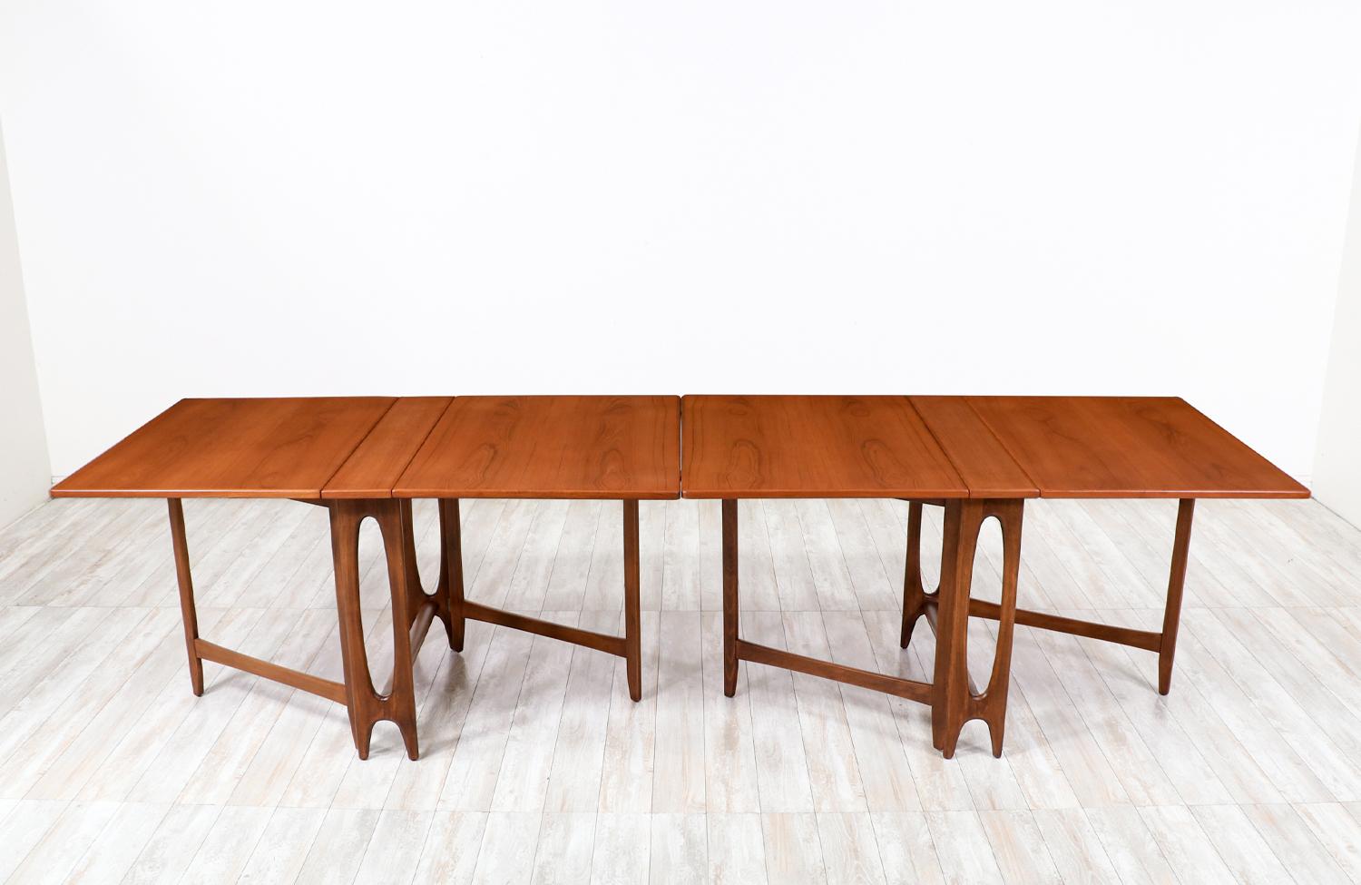 Dimensions
29in H  x  56.75 - 113.50in W x  35.50in D 

________________________________________________________________

Transforming a piece of Mid-Century Modern furniture is like bringing history back to life, and we take this journey with
