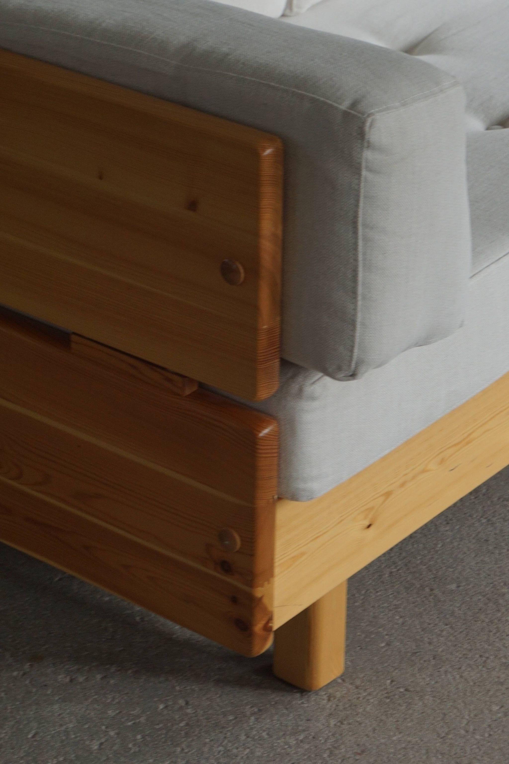 Norwegian modern three seater sofa in solid Pine, Designed by Swedish designer Jan-Erik Lindgren in 1976. 

The sofa is restored with new reupholsted cushions in white cotton that gives a new modern look. 
Such great comfort in this