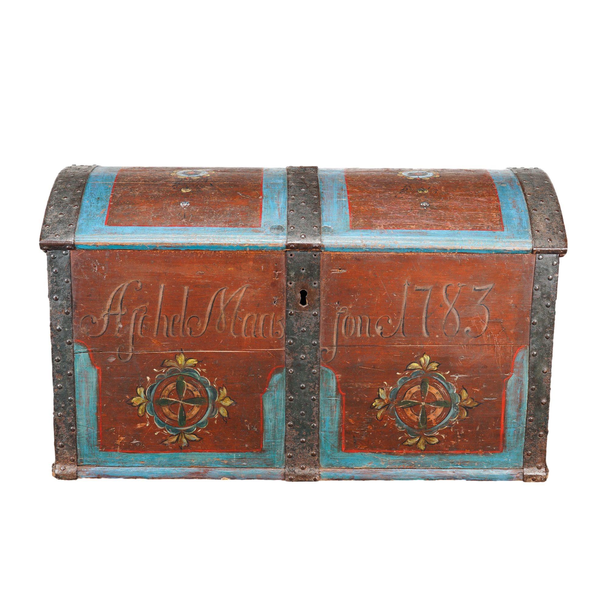 Norwegian painted pine coffer top trunk with original metal strapping and painted decoration. The base color is red with light blue boarder detailing and floral accents throughout.

Norway, 1783.