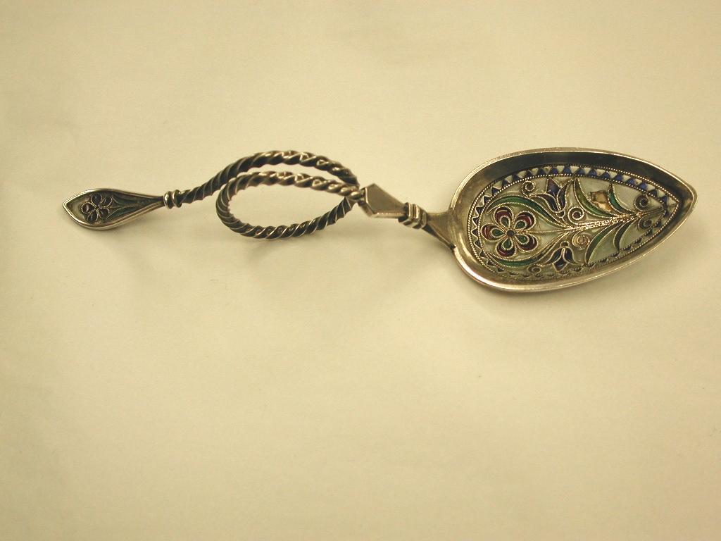 Norwegian Plique-a-Jour and silver decorative spoon, circa 1900
This spoon is typical of the Norwegian window pane effect enamel.
There is a slight imperfection in the glass in the bowl which is probably original.
  