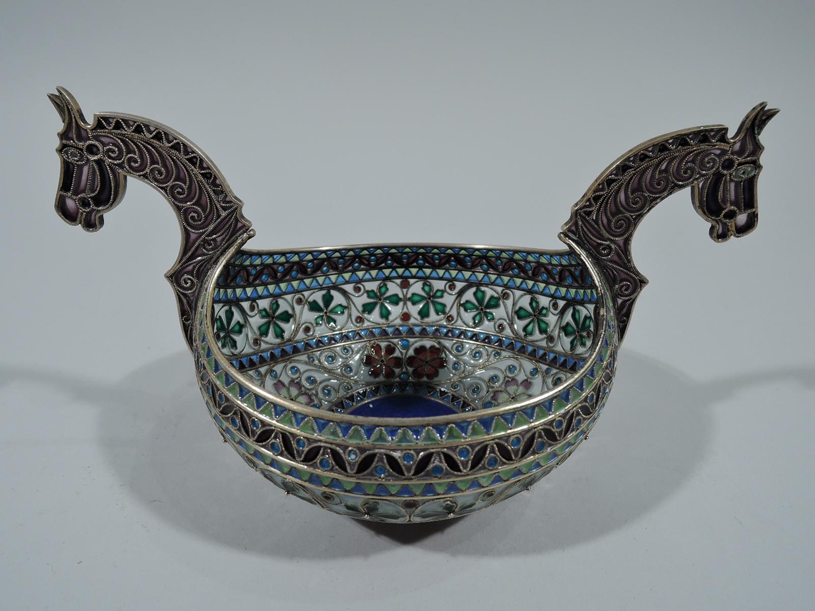 Plique-à-jour enamel and gilt 830 silver bowl. Made by Marius Hammer in Norway, circa 1910. Oval bowl with curved sides. Circular well with cobalt guilloche enamel interior. Horse bust end handles. Bands of stylized plant and geometric ornament.