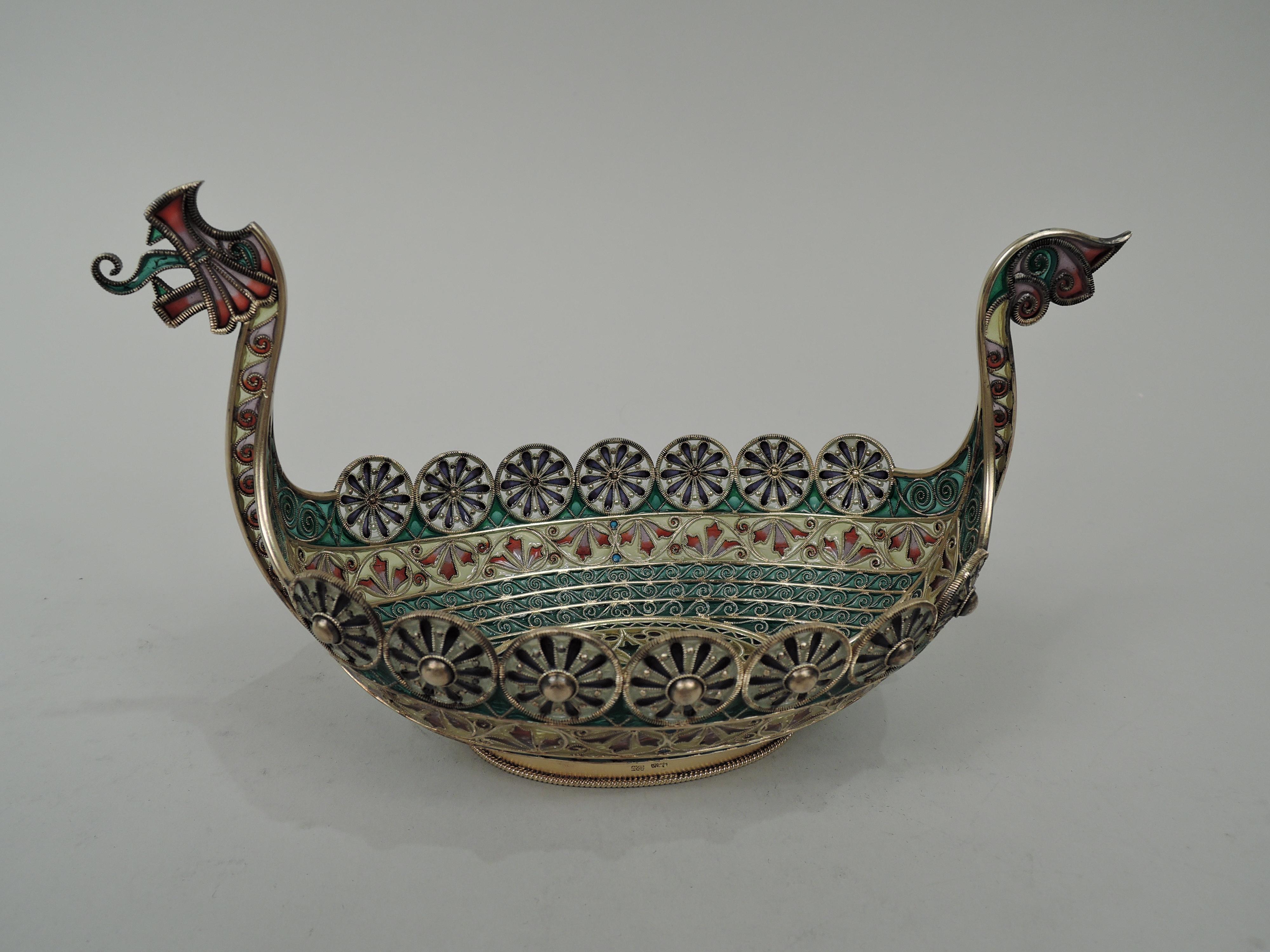 Plique à jour enamel and gilt sterling silver bowl. Made by David Andersen in Norway, circa 1925. Inspired by Viking longboat with dragonhead stem post and tail sternpost, and rim comprised of warrior’s shields. Oval form for stealthy gliding.