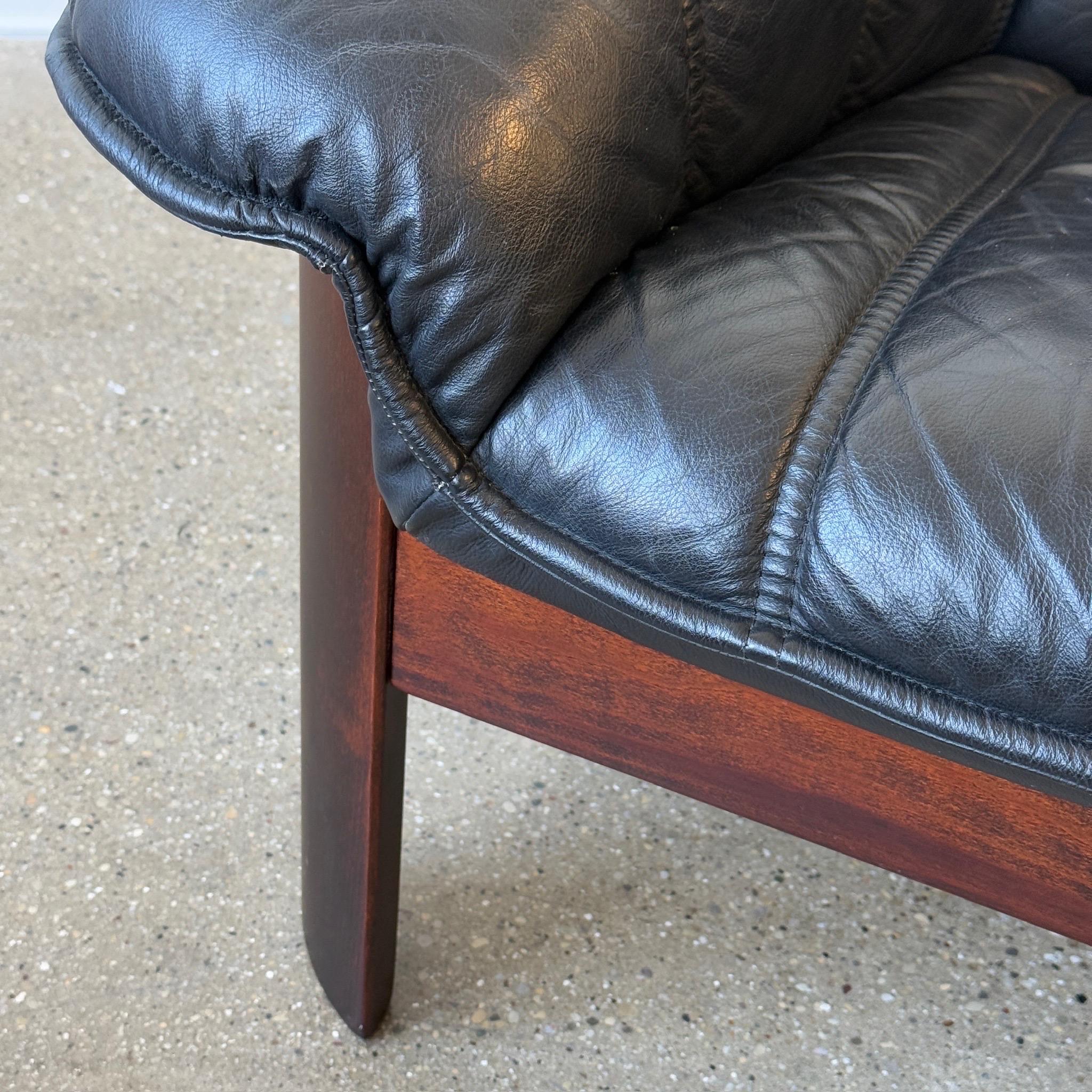 c. 1980s. Norway. Black leather cushion with rosewood frame. 

