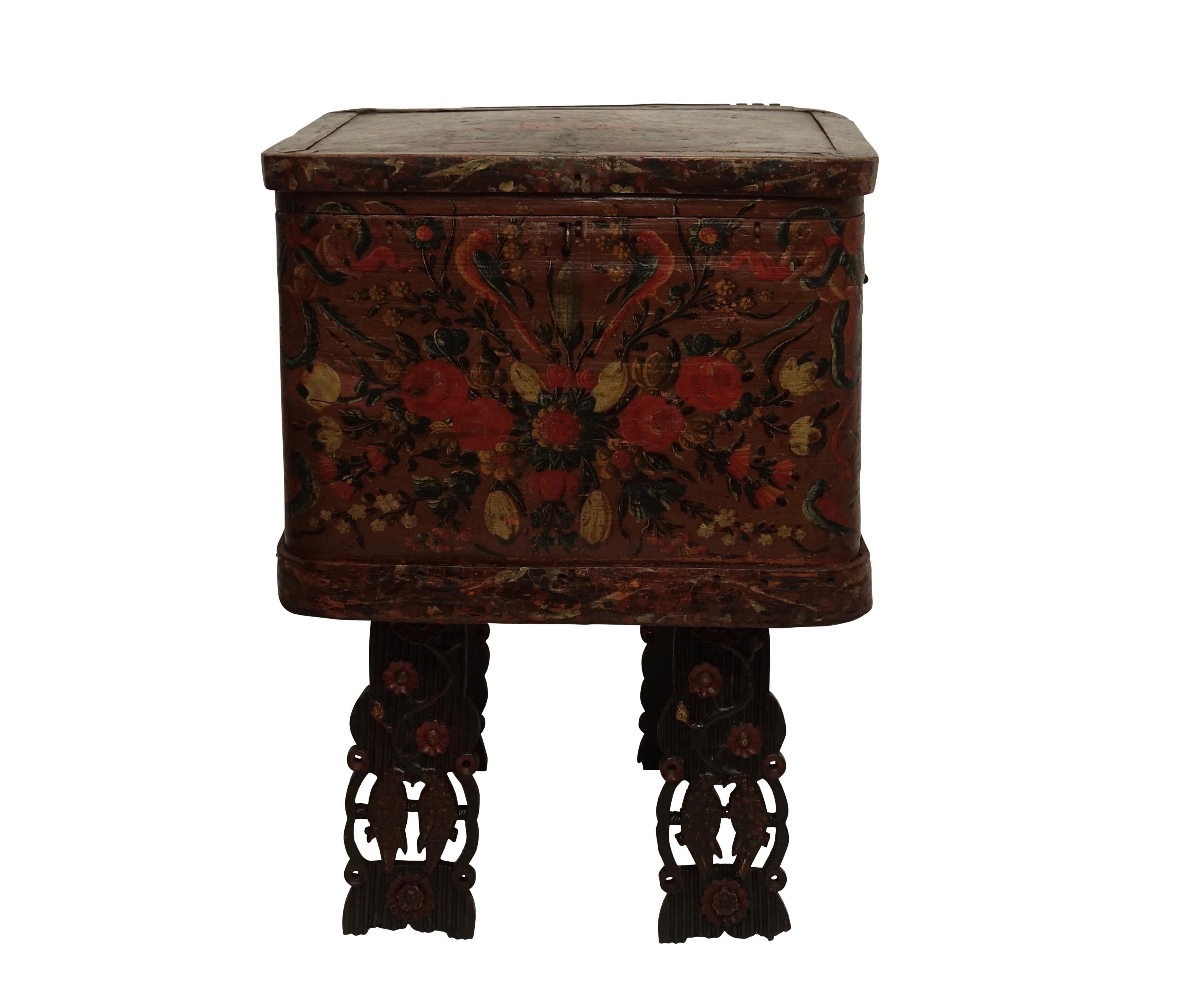 Colorful and brightly painted all-over with flowers and love birds, marriage or dowery chest on carved and painted legs, Scandinavian, circa 1800.