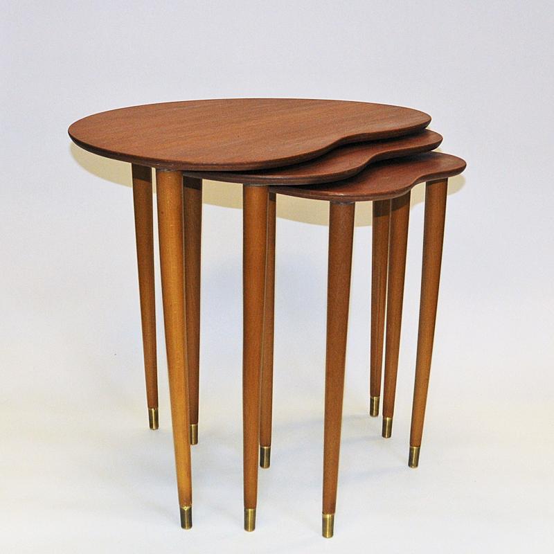 Lovely and elegant vintage  set of teak insert tables model 41598 by Hjerter Tres, Norway 1960s. Perfect tripple set both as several small tables, night tables or side tables. 
These midcentury insert tables have nicely heart rounded design in three