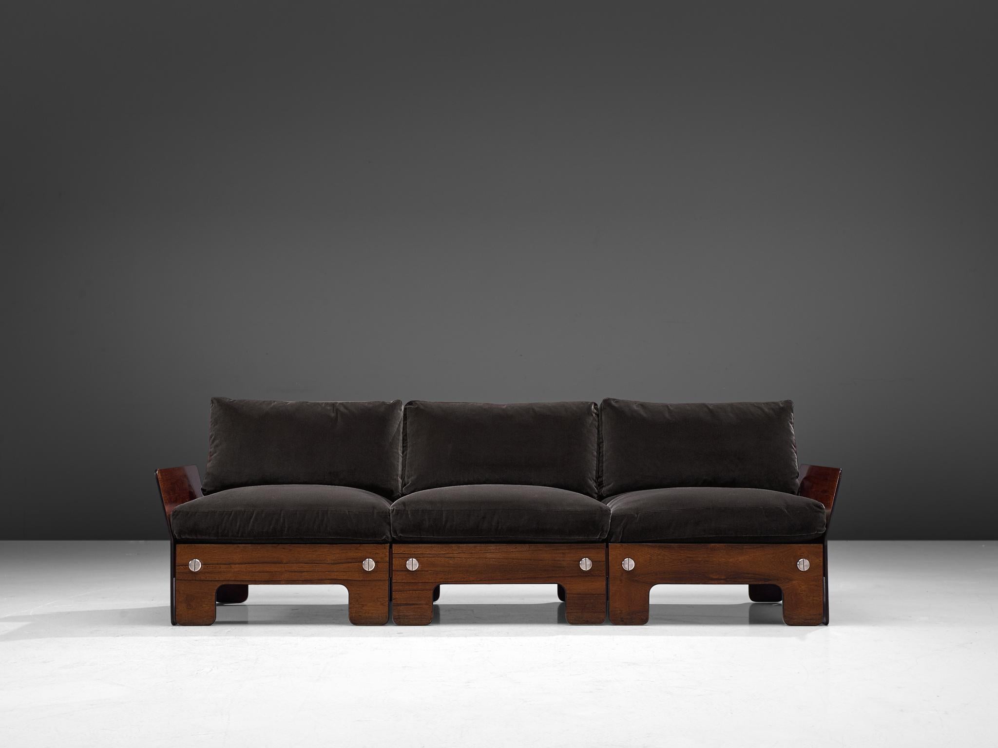Sofa, rosewood and black leather, Norway, 1960s

This sofa presents very comfortable elements. The boxy look of the sofa is due to its square and rectangular shape, which creates a potent look. The thick cushions are held together with press