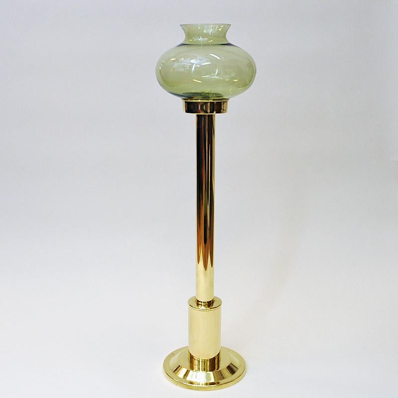 Mid-century large size brass candle holder with light green colored glass shade by Odel Messing, Norway 1960s. Beautifully tulip shaped and removable glass shade. You can also use the candle holder without the shade if you wish. Perfect also as a