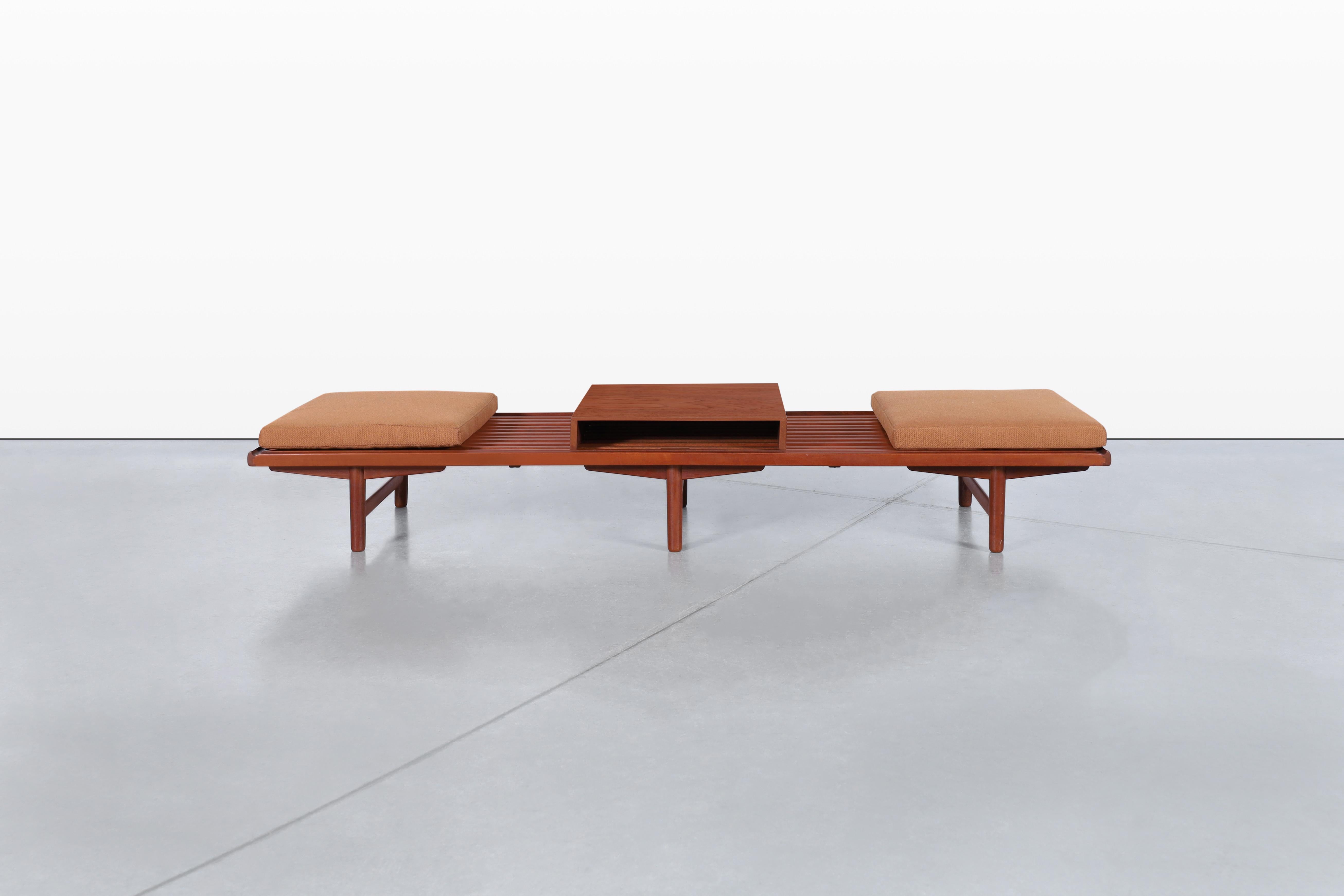 Imagine a beautifully crafted vintage teak bench/coffee table that embodies both elegance and versatility, designed by the talented Gerhard Berg and manufactured by P.I. Langlo Fabrikker, later exported under the Westnofa brand. This rare piece
