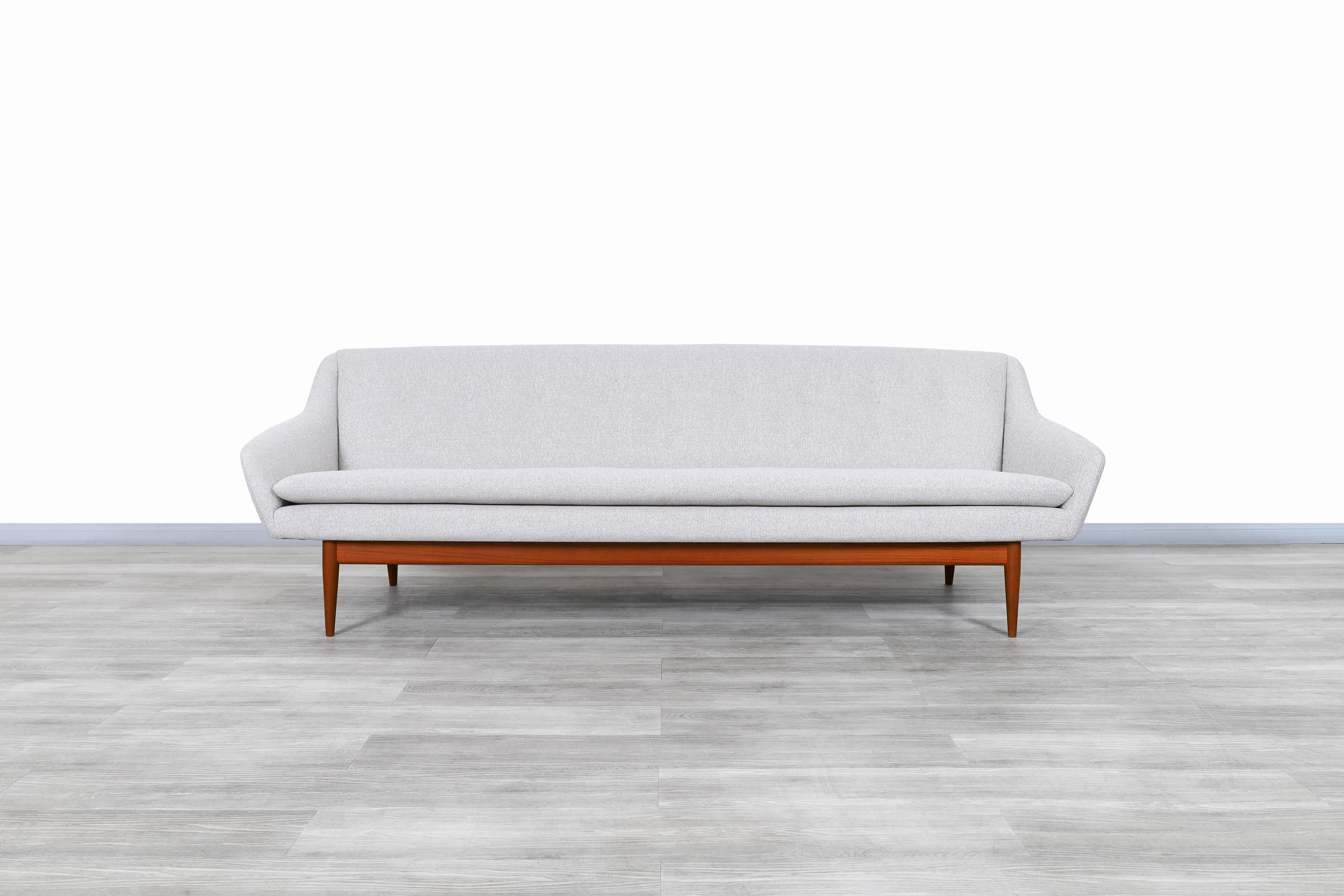 Exceptional Norwegian teak sofa designed by Gerhard Berg for LK Hjelle in Norway, circa 1960s. This sofa has a design that perfectly combines aesthetics in its figure and comfort for its use. Features a wide size seat which will comfortably seat