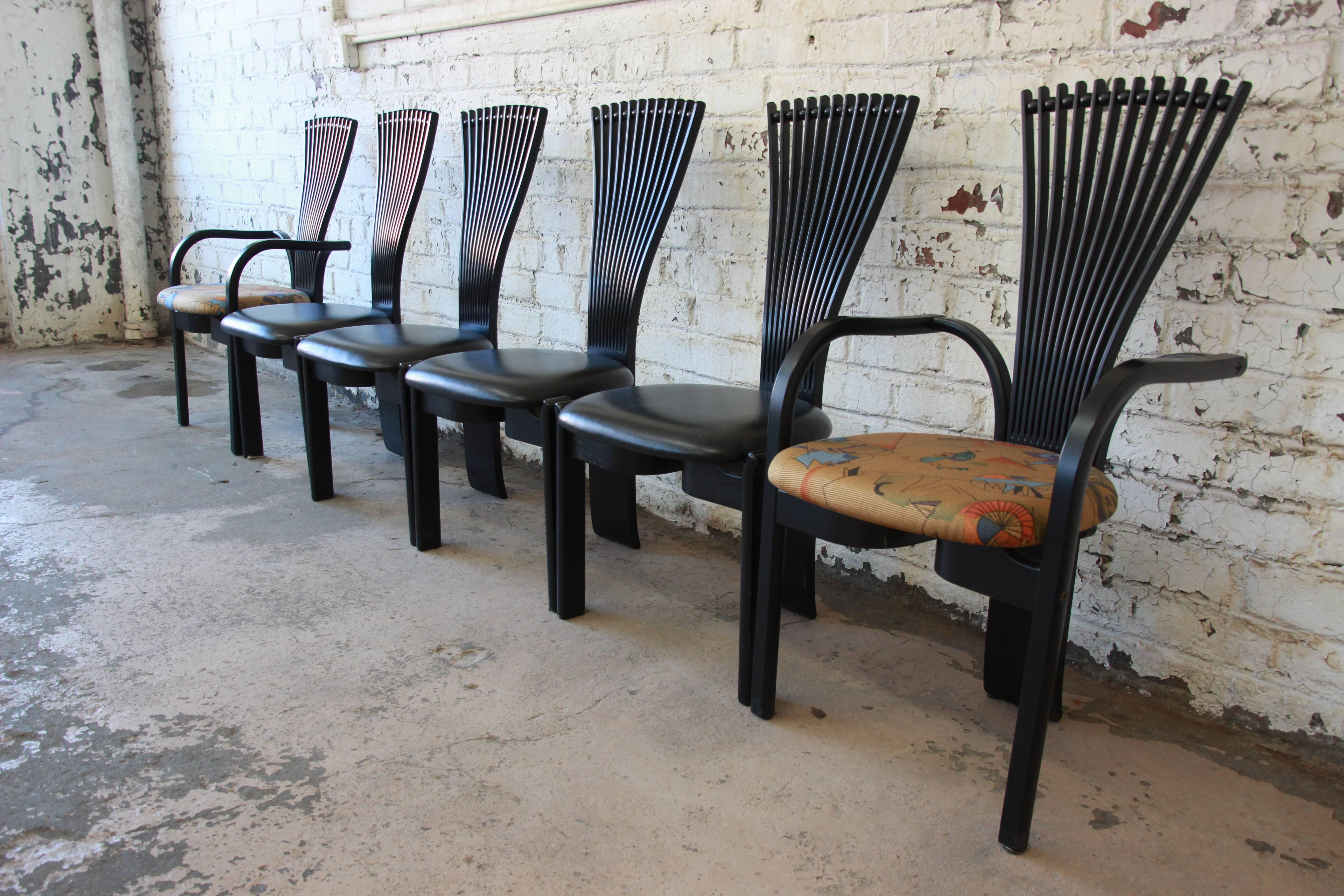 A stylish set of six Scandinavian Modern black lacquered TOTEM dining chairs designed in Norway by Torstein Nilsen for Westnofa. The set includes two captain chairs and four side chairs. The chairs have a stick and ball fanned back that are