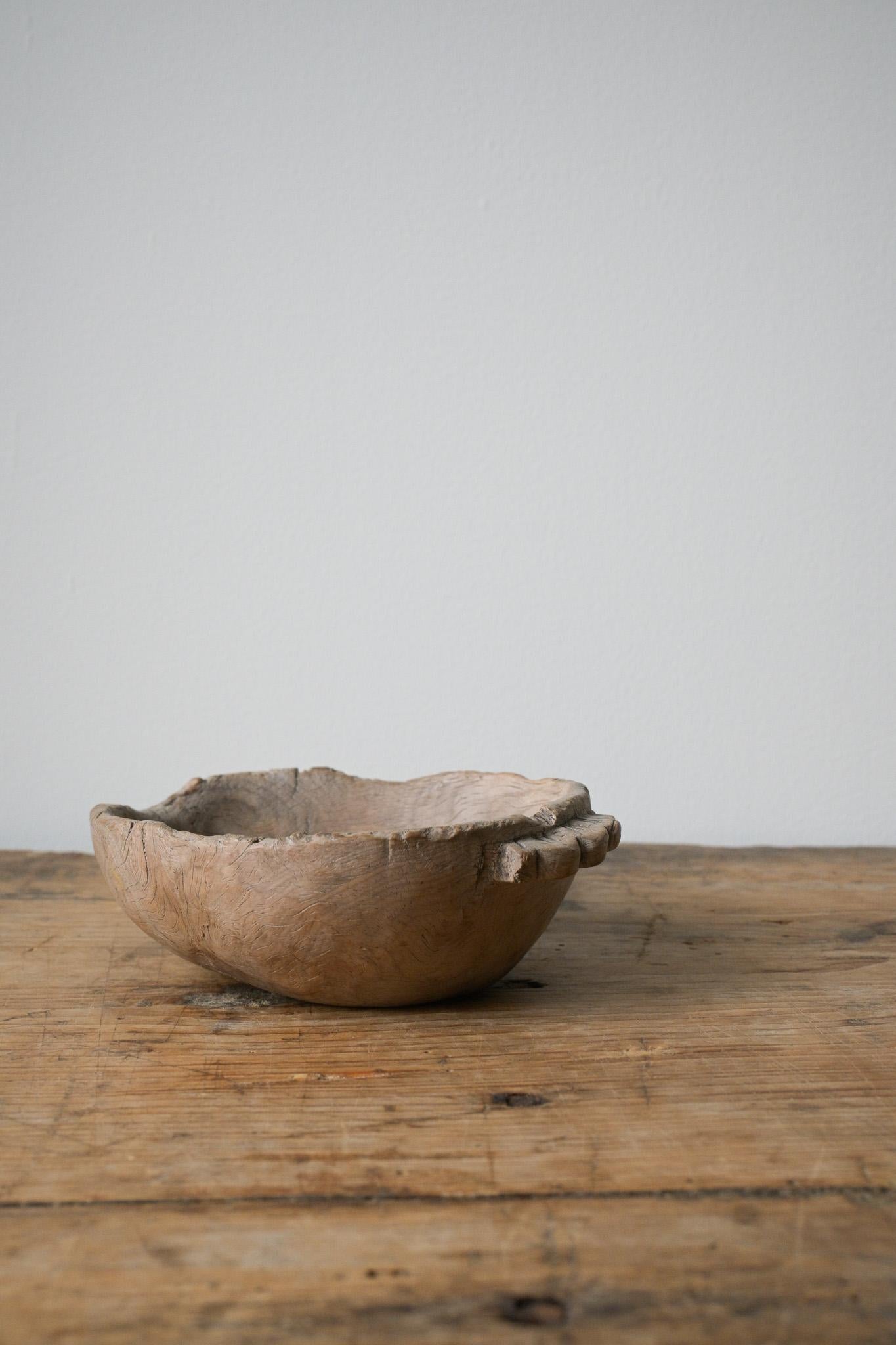 A Norwegian 'Trøys Skål' ca 1680-1730

This is a wooden vessel used to pour beer from the barrel into drinking bowls. Also often used to poor milk as well.
It was often ornately carved and played a key role in communal drinking during social
