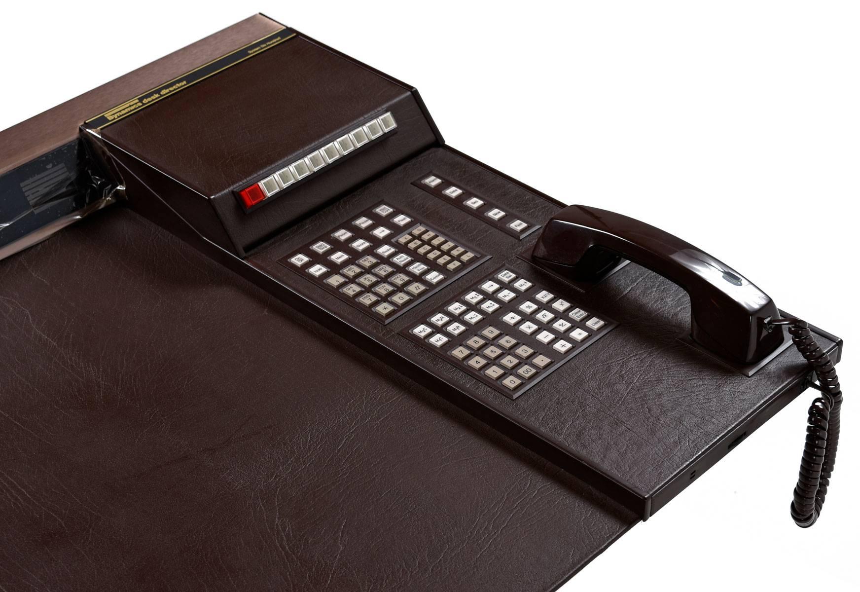 No status seeking, 1980s Wall Street executive should be without this leather bound desk apprentice. More than just a novelty item, this is a rare piece of tech and design history. If you can't afford a DeLorean, this desk director is the next best
