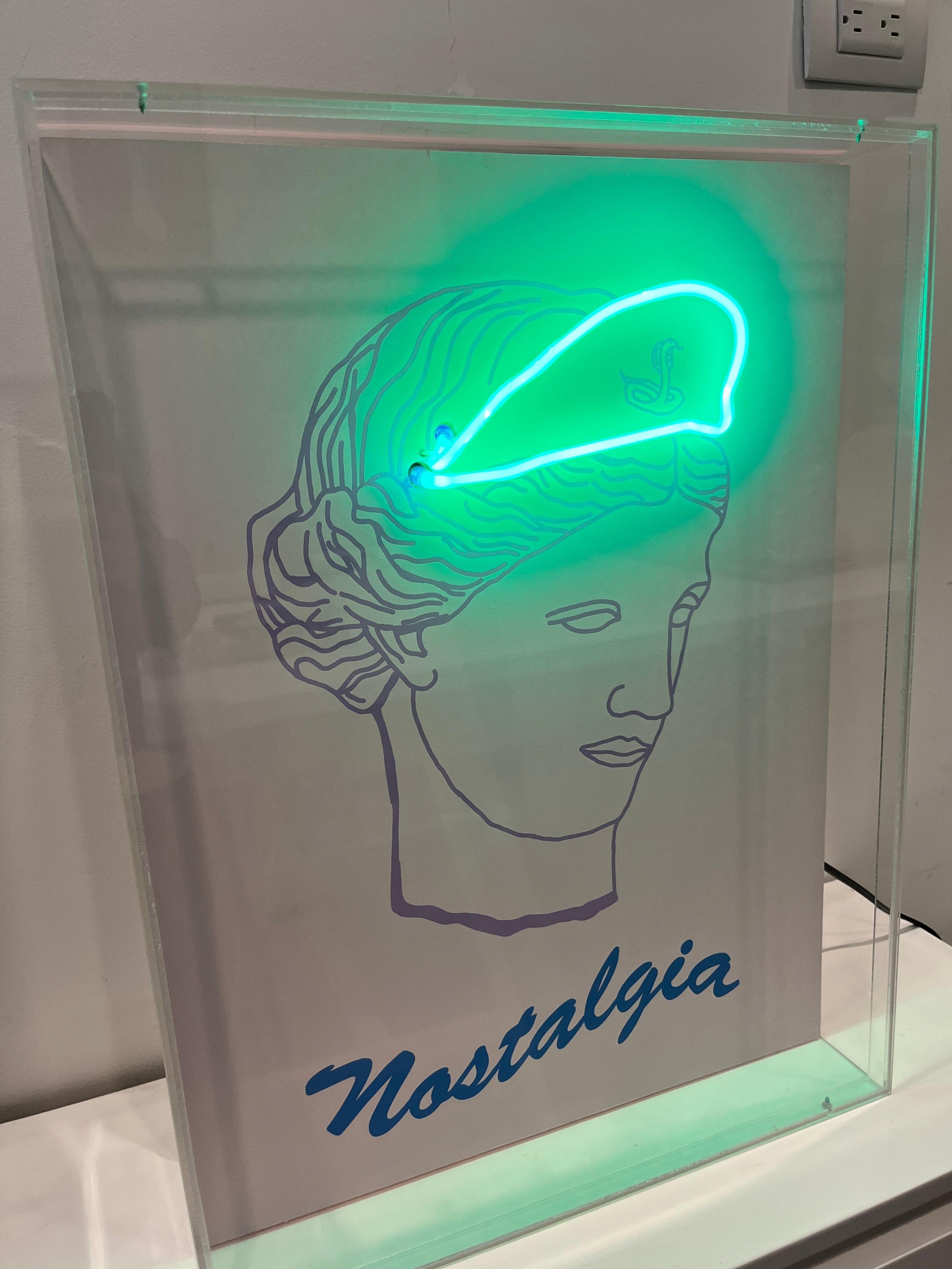 Nostalgia, 2019  Paloma Castello 
From the series Neon Classics
Screen printing with neon lights
Dimensions: 24 H in x 18.1 W x 5.9 D in. 
Edition 2/10

In her work She likes to bring life to objects or icons from the past, intervening in them a